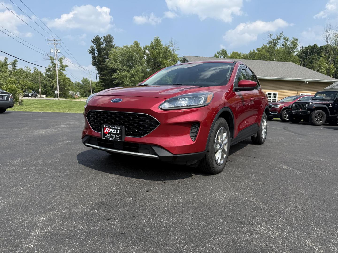 2020 Red /Black Ford Escape SE AWD (1FMCU9G68LU) with an 1.5L I3 DOHC 12V TURBO engine, 8-Speed Automatic transmission, located at 11115 Chardon Rd. , Chardon, OH, 44024, (440) 214-9705, 41.580246, -81.241943 - This 2020 Ford Escape SE is a modern and fuel efficient SUV. Equipped with a 1.5 I3 Turbocharged EcoBoost engine and a 8 speed automatic transmission this Escape achieves a very impressive 28 MPG combined and 31 MPG highway. On the inside it has a power drivers seat, heated front seats and, automati - Photo#0