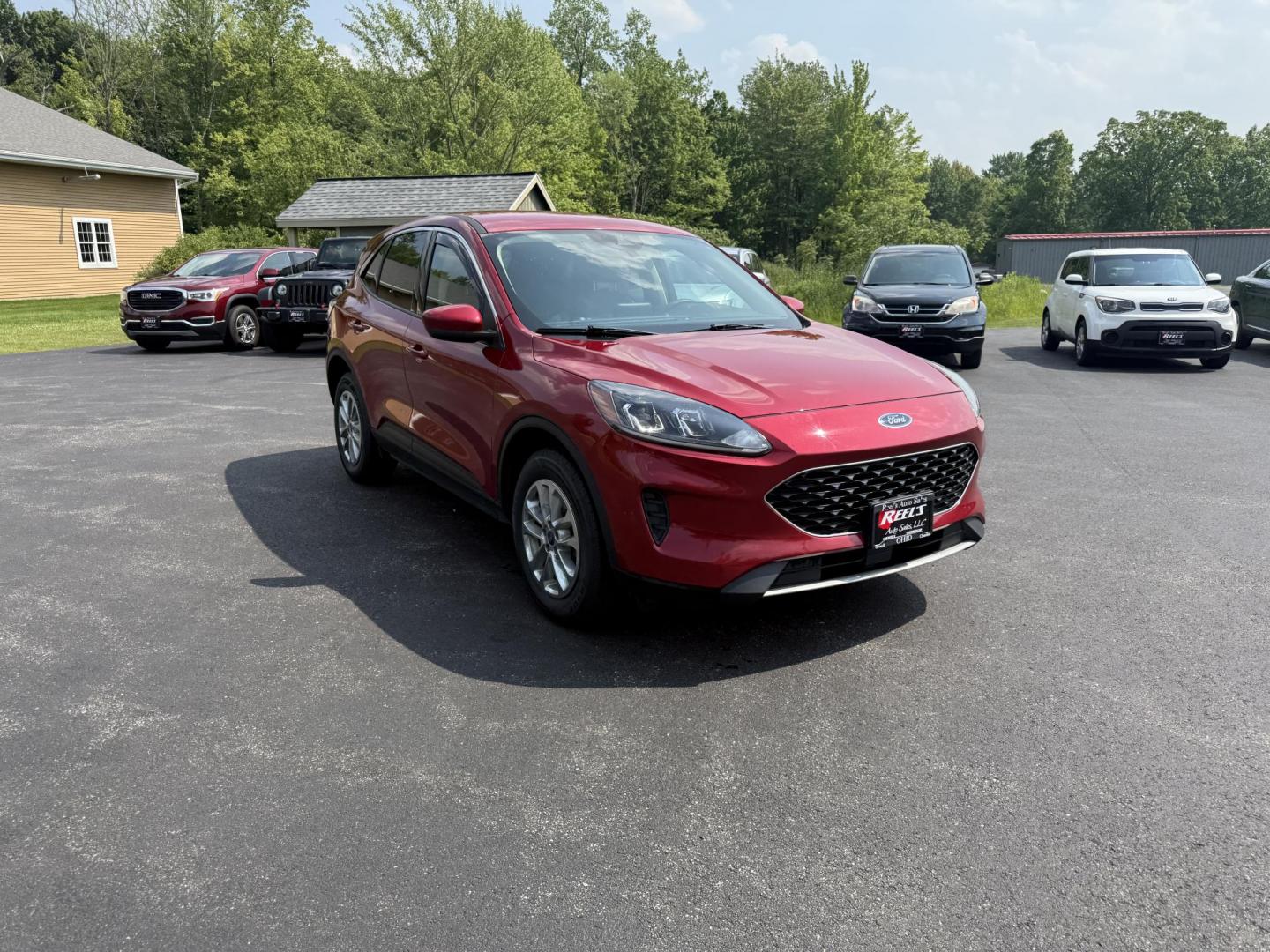 2020 Red /Black Ford Escape SE AWD (1FMCU9G68LU) with an 1.5L I3 DOHC 12V TURBO engine, 8-Speed Automatic transmission, located at 11115 Chardon Rd. , Chardon, OH, 44024, (440) 214-9705, 41.580246, -81.241943 - This 2020 Ford Escape SE is a modern and fuel efficient SUV. Equipped with a 1.5 I3 Turbocharged EcoBoost engine and a 8 speed automatic transmission this Escape achieves a very impressive 28 MPG combined and 31 MPG highway. On the inside it has a power drivers seat, heated front seats and, automati - Photo#2