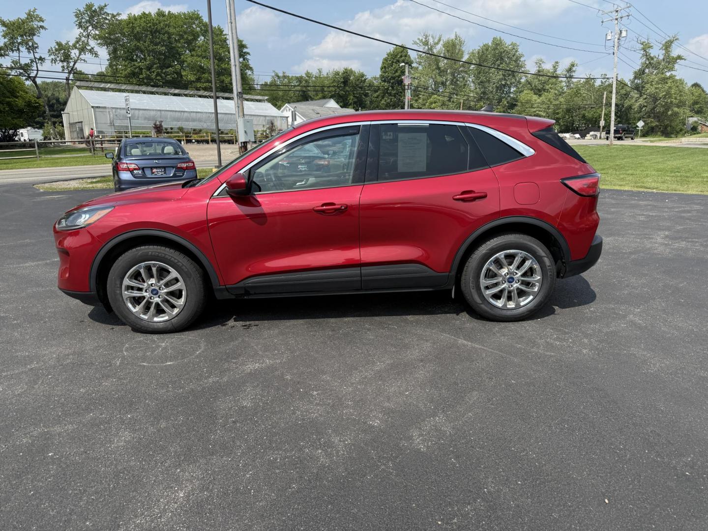 2020 Red /Black Ford Escape SE AWD (1FMCU9G68LU) with an 1.5L I3 DOHC 12V TURBO engine, 8-Speed Automatic transmission, located at 11115 Chardon Rd. , Chardon, OH, 44024, (440) 214-9705, 41.580246, -81.241943 - This 2020 Ford Escape SE is a modern and fuel efficient SUV. Equipped with a 1.5 I3 Turbocharged EcoBoost engine and a 8 speed automatic transmission this Escape achieves a very impressive 28 MPG combined and 31 MPG highway. On the inside it has a power drivers seat, heated front seats and, automati - Photo#12