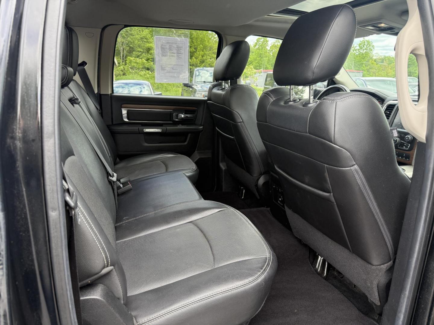 2014 Black /Black RAM 1500 Laramie Crew Cab SWB 4WD (1C6RR7NT3ES) with an 5.7L V8 OHV 16V engine, 8-Speed Automatic transmission, located at 11115 Chardon Rd. , Chardon, OH, 44024, (440) 214-9705, 41.580246, -81.241943 - FRESH TRADE ALERT ---- This 2014 Ram 1500 is a luxurious pickup truck with plenty of capability. Powered by a 5.7 HEMI V8, 8 speed automatic transmission and, 3.93 gearing this Ram is rated to tow 10,300 pounds. On the inside you'll find a beautiful leather wrapped interior with heated and cooled fr - Photo#39