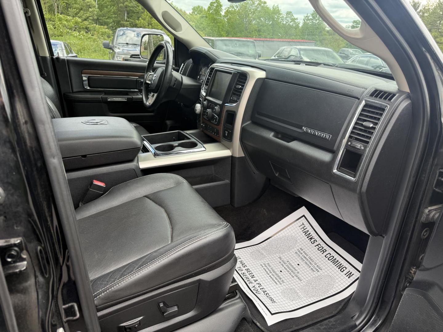 2014 Black /Black RAM 1500 Laramie Crew Cab SWB 4WD (1C6RR7NT3ES) with an 5.7L V8 OHV 16V engine, 8-Speed Automatic transmission, located at 11115 Chardon Rd. , Chardon, OH, 44024, (440) 214-9705, 41.580246, -81.241943 - FRESH TRADE ALERT ---- This 2014 Ram 1500 is a luxurious pickup truck with plenty of capability. Powered by a 5.7 HEMI V8, 8 speed automatic transmission and, 3.93 gearing this Ram is rated to tow 10,300 pounds. On the inside you'll find a beautiful leather wrapped interior with heated and cooled fr - Photo#41