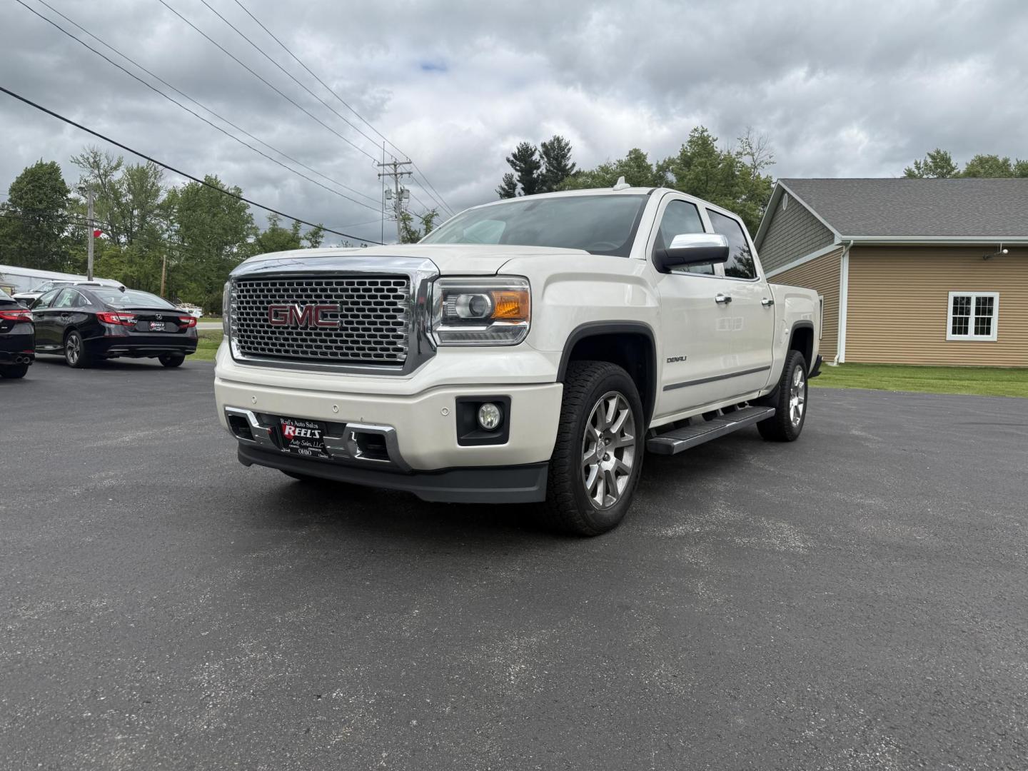 2015 White /Brown GMC Sierra 1500 Denali Crew Cab Short Box 4WD (3GTU2WEJ7FG) with an 6.2L V8 OHV 16V engine, 8-Speed Automatic transmission, located at 11115 Chardon Rd. , Chardon, OH, 44024, (440) 214-9705, 41.580246, -81.241943 - This 2015 GMC Sierra 1500 Denali is GM's greatest they have to offer. Powered by a 6.2 V8 Engine and an 8 speed automatic transmission this truck is rated to tow 9,200 pounds while giving you all the luxury of a Cadillac. On the inside you will find an incredible leather interior, heated and cooled - Photo#0