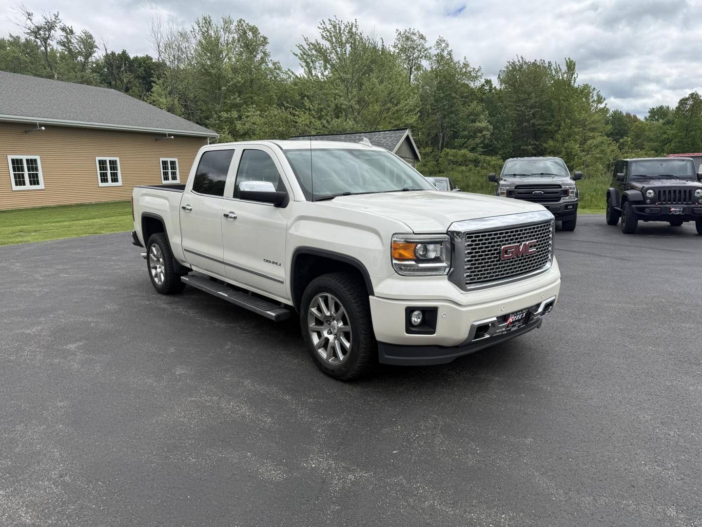 2015 White /Brown GMC Sierra 1500 Denali Crew Cab Short Box 4WD (3GTU2WEJ7FG) with an 6.2L V8 OHV 16V engine, 8-Speed Automatic transmission, located at 11115 Chardon Rd. , Chardon, OH, 44024, (440) 214-9705, 41.580246, -81.241943 - This 2015 GMC Sierra 1500 Denali is GM's greatest they have to offer. Powered by a 6.2 V8 Engine and an 8 speed automatic transmission this truck is rated to tow 9,200 pounds while giving you all the luxury of a Cadillac. On the inside you will find an incredible leather interior, heated and cooled - Photo#2