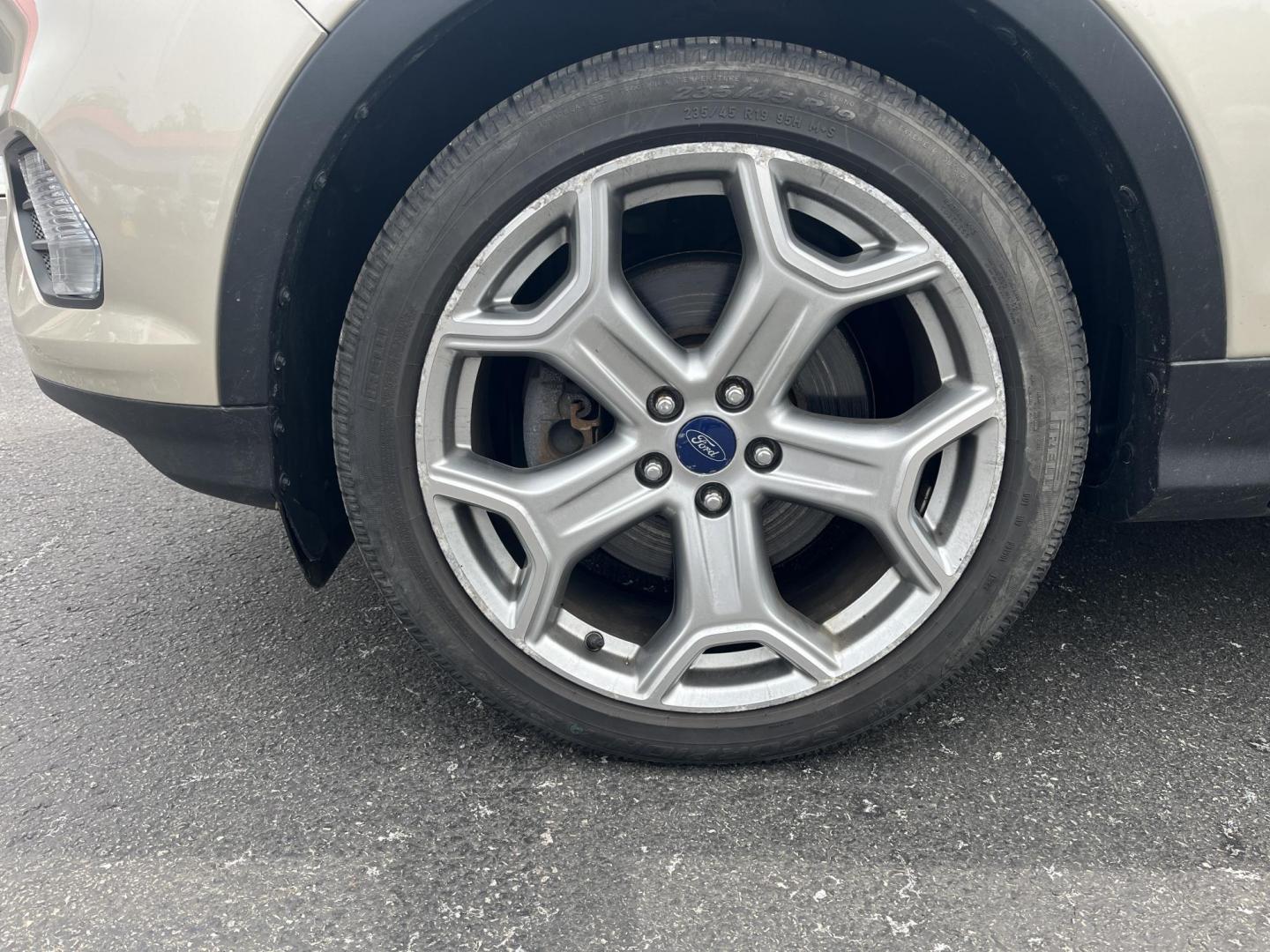 2017 Gold /Gray Ford Escape Titanium 4WD (1FMCU9J96HU) with an 2.0L I4 DOHC 16V Turbo engine, 6A transmission, located at 547 E. Main St., Orwell, OH, 44076, (440) 437-5893, 41.535435, -80.847855 - This One Owner 2017 Ford Escape Titanium is a feature rich compact SUV. Powered by a 2.0 I4 Turbocharged EcoBoost engine and a 6 speed automatic transmission this Escape is quick and fuel efficient achieving an EPA estimated 27 MPG highway. On the inside you get a leather wrapped interior, power fro - Photo#4