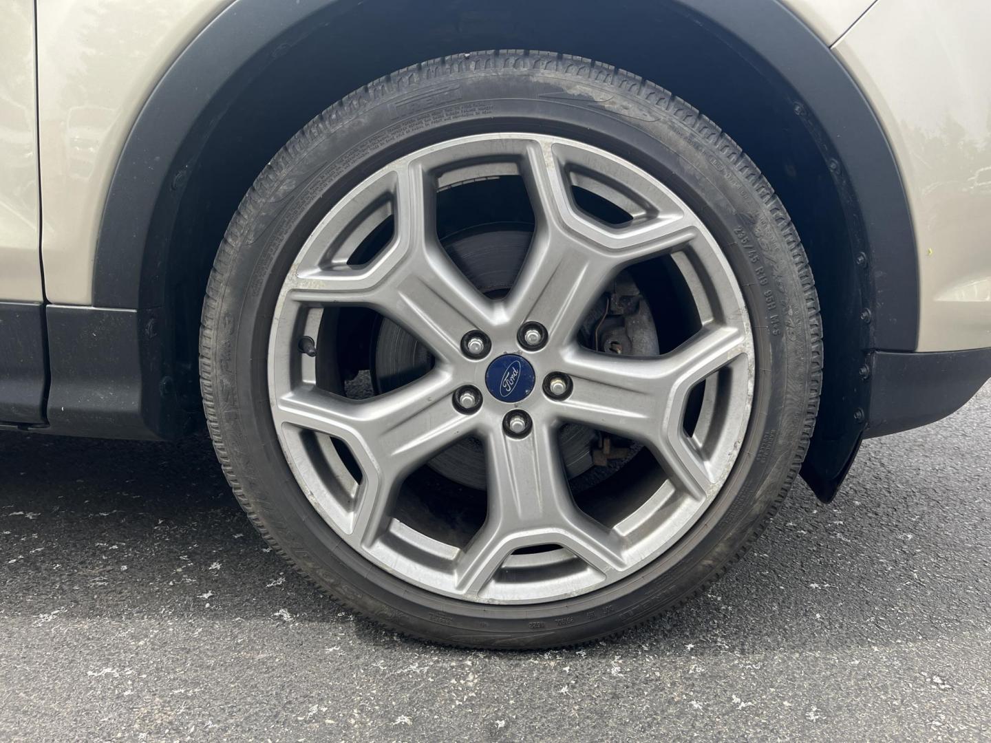 2017 Gold /Gray Ford Escape Titanium 4WD (1FMCU9J96HU) with an 2.0L I4 DOHC 16V Turbo engine, 6A transmission, located at 547 E. Main St., Orwell, OH, 44076, (440) 437-5893, 41.535435, -80.847855 - This One Owner 2017 Ford Escape Titanium is a feature rich compact SUV. Powered by a 2.0 I4 Turbocharged EcoBoost engine and a 6 speed automatic transmission this Escape is quick and fuel efficient achieving an EPA estimated 27 MPG highway. On the inside you get a leather wrapped interior, power fro - Photo#7