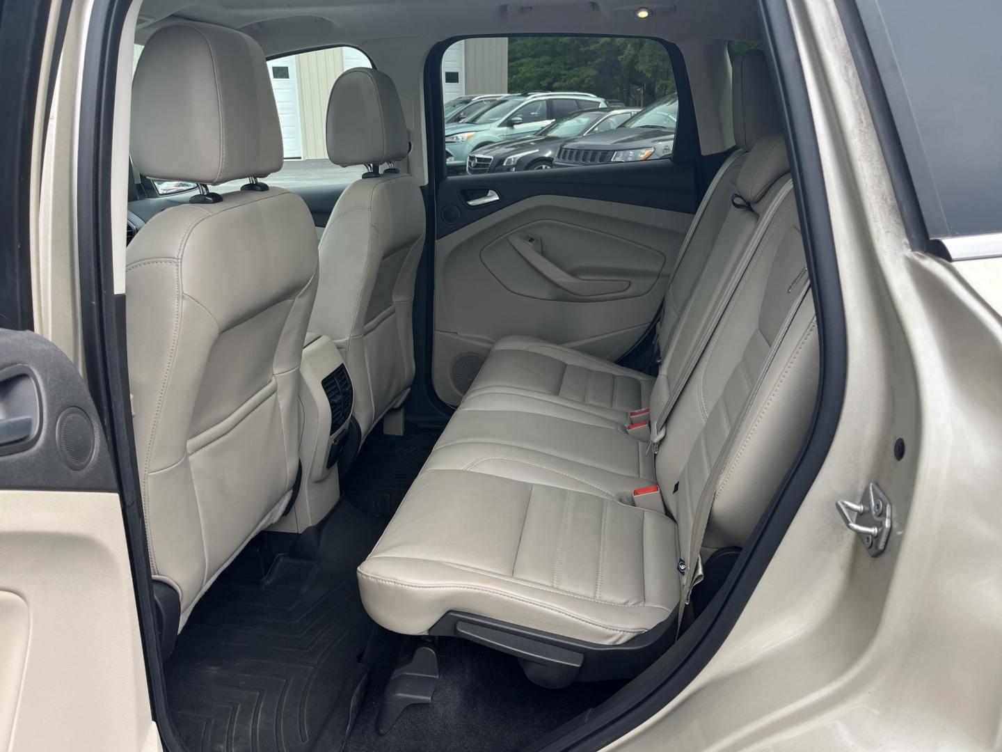 2017 Gold /Gray Ford Escape Titanium 4WD (1FMCU9J96HU) with an 2.0L I4 DOHC 16V Turbo engine, 6A transmission, located at 547 E. Main St., Orwell, OH, 44076, (440) 437-5893, 41.535435, -80.847855 - This One Owner 2017 Ford Escape Titanium is a feature rich compact SUV. Powered by a 2.0 I4 Turbocharged EcoBoost engine and a 6 speed automatic transmission this Escape is quick and fuel efficient achieving an EPA estimated 27 MPG highway. On the inside you get a leather wrapped interior, power fro - Photo#21