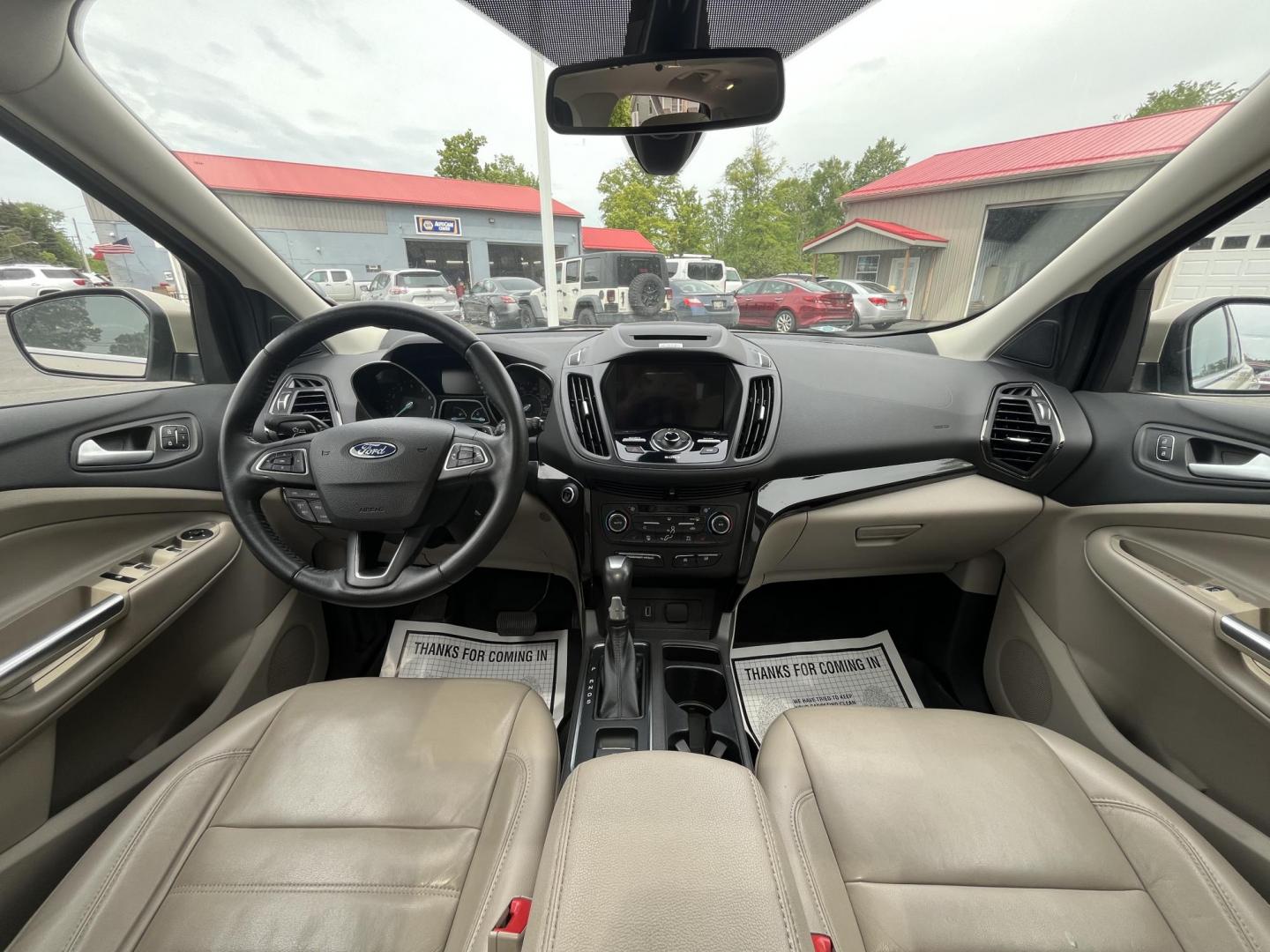 2017 Gold /Gray Ford Escape Titanium 4WD (1FMCU9J96HU) with an 2.0L I4 DOHC 16V Turbo engine, 6A transmission, located at 547 E. Main St., Orwell, OH, 44076, (440) 437-5893, 41.535435, -80.847855 - This One Owner 2017 Ford Escape Titanium is a feature rich compact SUV. Powered by a 2.0 I4 Turbocharged EcoBoost engine and a 6 speed automatic transmission this Escape is quick and fuel efficient achieving an EPA estimated 27 MPG highway. On the inside you get a leather wrapped interior, power fro - Photo#23