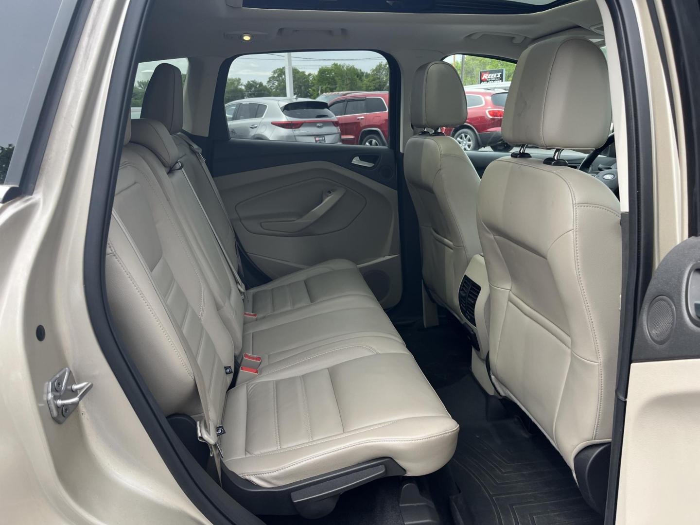 2017 Gold /Gray Ford Escape Titanium 4WD (1FMCU9J96HU) with an 2.0L I4 DOHC 16V Turbo engine, 6A transmission, located at 547 E. Main St., Orwell, OH, 44076, (440) 437-5893, 41.535435, -80.847855 - This One Owner 2017 Ford Escape Titanium is a feature rich compact SUV. Powered by a 2.0 I4 Turbocharged EcoBoost engine and a 6 speed automatic transmission this Escape is quick and fuel efficient achieving an EPA estimated 27 MPG highway. On the inside you get a leather wrapped interior, power fro - Photo#25