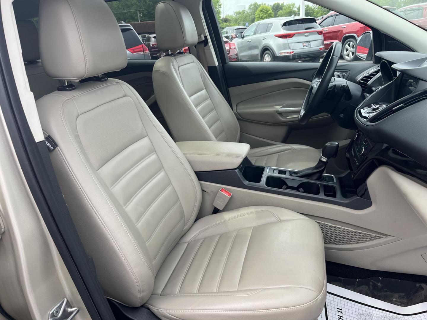 2017 Gold /Gray Ford Escape Titanium 4WD (1FMCU9J96HU) with an 2.0L I4 DOHC 16V Turbo engine, 6A transmission, located at 547 E. Main St., Orwell, OH, 44076, (440) 437-5893, 41.535435, -80.847855 - This One Owner 2017 Ford Escape Titanium is a feature rich compact SUV. Powered by a 2.0 I4 Turbocharged EcoBoost engine and a 6 speed automatic transmission this Escape is quick and fuel efficient achieving an EPA estimated 27 MPG highway. On the inside you get a leather wrapped interior, power fro - Photo#29
