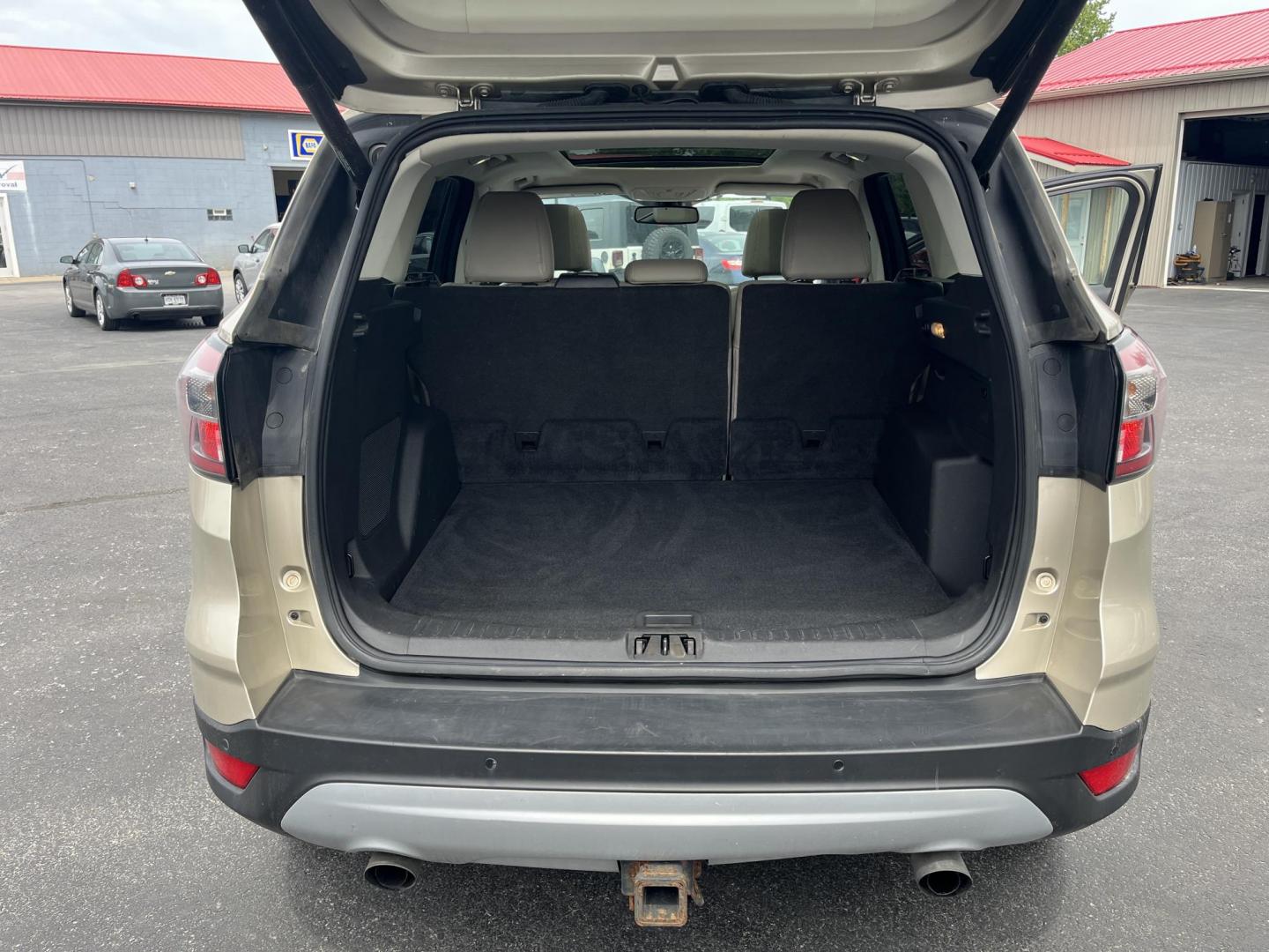 2017 Gold /Gray Ford Escape Titanium 4WD (1FMCU9J96HU) with an 2.0L I4 DOHC 16V Turbo engine, 6A transmission, located at 547 E. Main St., Orwell, OH, 44076, (440) 437-5893, 41.535435, -80.847855 - This One Owner 2017 Ford Escape Titanium is a feature rich compact SUV. Powered by a 2.0 I4 Turbocharged EcoBoost engine and a 6 speed automatic transmission this Escape is quick and fuel efficient achieving an EPA estimated 27 MPG highway. On the inside you get a leather wrapped interior, power fro - Photo#30