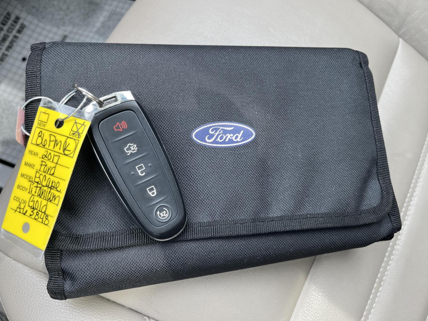 2017 Gold /Gray Ford Escape Titanium 4WD (1FMCU9J96HU) with an 2.0L I4 DOHC 16V Turbo engine, 6A transmission, located at 547 E. Main St., Orwell, OH, 44076, (440) 437-5893, 41.535435, -80.847855 - This One Owner 2017 Ford Escape Titanium is a feature rich compact SUV. Powered by a 2.0 I4 Turbocharged EcoBoost engine and a 6 speed automatic transmission this Escape is quick and fuel efficient achieving an EPA estimated 27 MPG highway. On the inside you get a leather wrapped interior, power fro - Photo#31