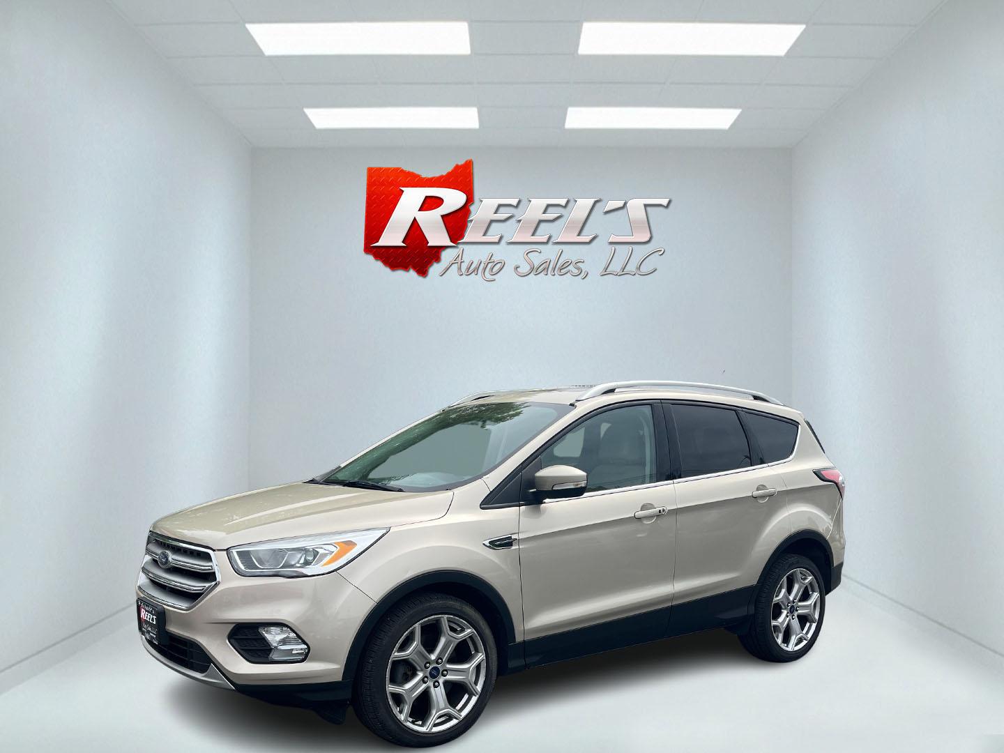 2017 Gold /Gray Ford Escape Titanium 4WD (1FMCU9J96HU) with an 2.0L I4 DOHC 16V Turbo engine, 6A transmission, located at 547 E. Main St., Orwell, OH, 44076, (440) 437-5893, 41.535435, -80.847855 - This One Owner 2017 Ford Escape Titanium is a feature rich compact SUV. Powered by a 2.0 I4 Turbocharged EcoBoost engine and a 6 speed automatic transmission this Escape is quick and fuel efficient achieving an EPA estimated 27 MPG highway. On the inside you get a leather wrapped interior, power fro - Photo#32