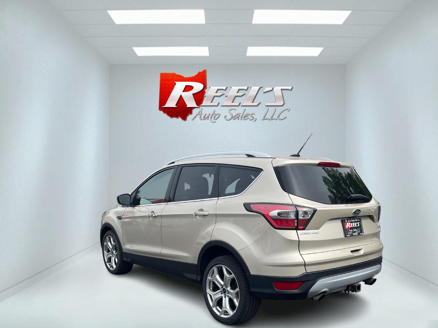 2017 Gold /Gray Ford Escape Titanium 4WD (1FMCU9J96HU) with an 2.0L I4 DOHC 16V Turbo engine, 6A transmission, located at 547 E. Main St., Orwell, OH, 44076, (440) 437-5893, 41.535435, -80.847855 - This One Owner 2017 Ford Escape Titanium is a feature rich compact SUV. Powered by a 2.0 I4 Turbocharged EcoBoost engine and a 6 speed automatic transmission this Escape is quick and fuel efficient achieving an EPA estimated 27 MPG highway. On the inside you get a leather wrapped interior, power fro - Photo#34