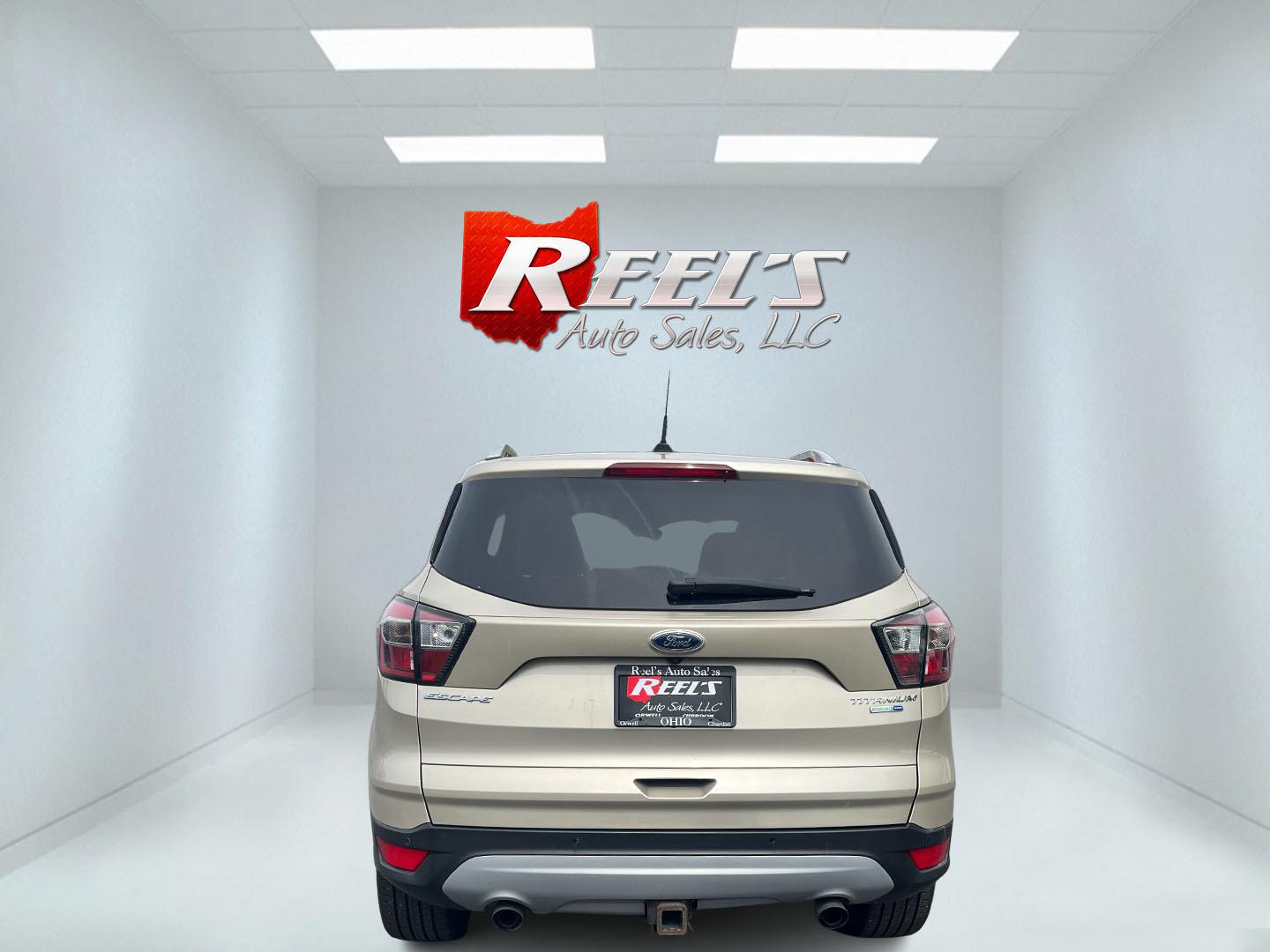2017 Gold /Gray Ford Escape Titanium 4WD (1FMCU9J96HU) with an 2.0L I4 DOHC 16V Turbo engine, 6A transmission, located at 547 E. Main St., Orwell, OH, 44076, (440) 437-5893, 41.535435, -80.847855 - This One Owner 2017 Ford Escape Titanium is a feature rich compact SUV. Powered by a 2.0 I4 Turbocharged EcoBoost engine and a 6 speed automatic transmission this Escape is quick and fuel efficient achieving an EPA estimated 27 MPG highway. On the inside you get a leather wrapped interior, power fro - Photo#35