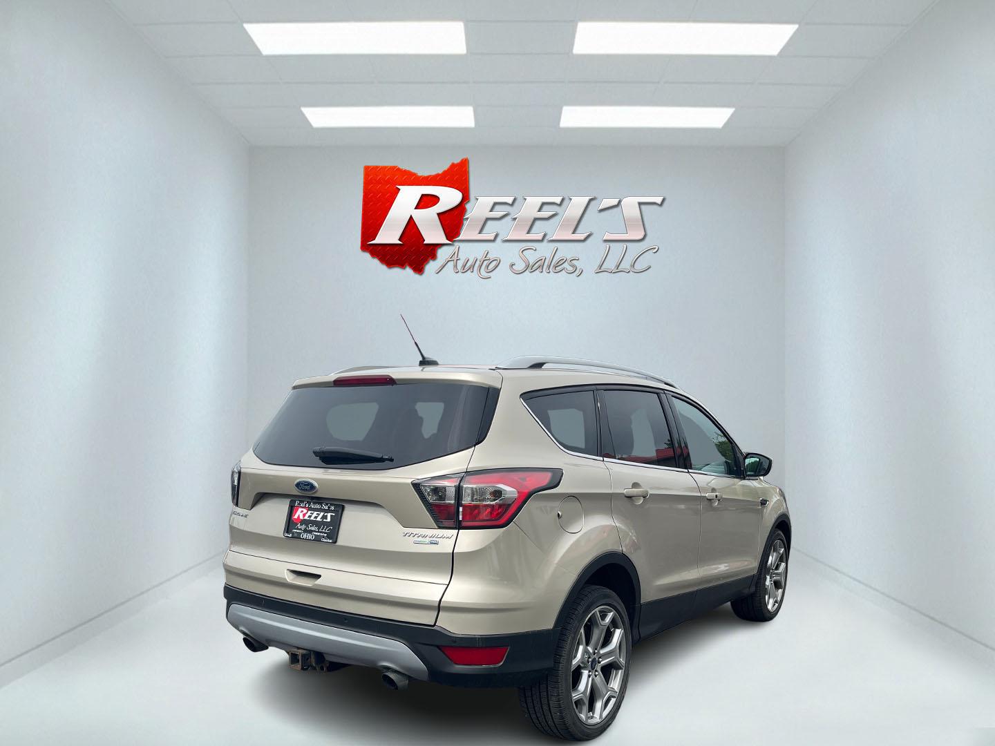 2017 Gold /Gray Ford Escape Titanium 4WD (1FMCU9J96HU) with an 2.0L I4 DOHC 16V Turbo engine, 6A transmission, located at 547 E. Main St., Orwell, OH, 44076, (440) 437-5893, 41.535435, -80.847855 - This One Owner 2017 Ford Escape Titanium is a feature rich compact SUV. Powered by a 2.0 I4 Turbocharged EcoBoost engine and a 6 speed automatic transmission this Escape is quick and fuel efficient achieving an EPA estimated 27 MPG highway. On the inside you get a leather wrapped interior, power fro - Photo#36