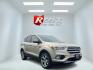 2017 Gold /Gray Ford Escape Titanium 4WD (1FMCU9J96HU) with an 2.0L I4 DOHC 16V Turbo engine, 6A transmission, located at 547 E. Main St., Orwell, OH, 44076, (440) 437-5893, 41.535435, -80.847855 - This One Owner 2017 Ford Escape Titanium is a feature rich compact SUV. Powered by a 2.0 I4 Turbocharged EcoBoost engine and a 6 speed automatic transmission this Escape is quick and fuel efficient achieving an EPA estimated 27 MPG highway. On the inside you get a leather wrapped interior, power fro - Photo#2