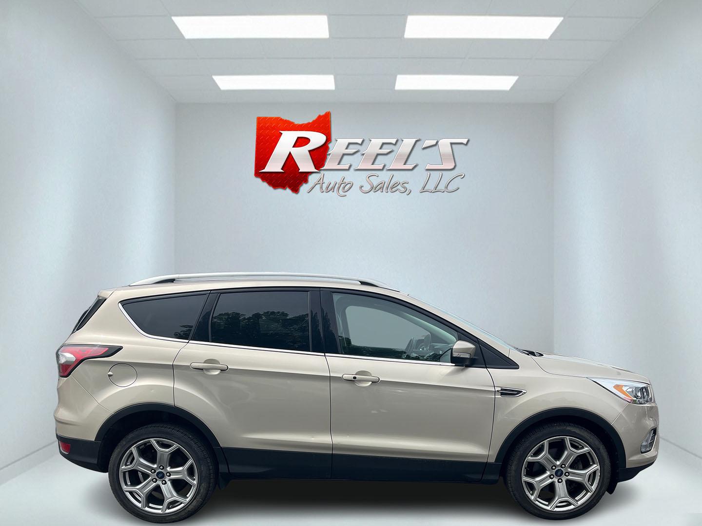 2017 Gold /Gray Ford Escape Titanium 4WD (1FMCU9J96HU) with an 2.0L I4 DOHC 16V Turbo engine, 6A transmission, located at 547 E. Main St., Orwell, OH, 44076, (440) 437-5893, 41.535435, -80.847855 - This One Owner 2017 Ford Escape Titanium is a feature rich compact SUV. Powered by a 2.0 I4 Turbocharged EcoBoost engine and a 6 speed automatic transmission this Escape is quick and fuel efficient achieving an EPA estimated 27 MPG highway. On the inside you get a leather wrapped interior, power fro - Photo#37