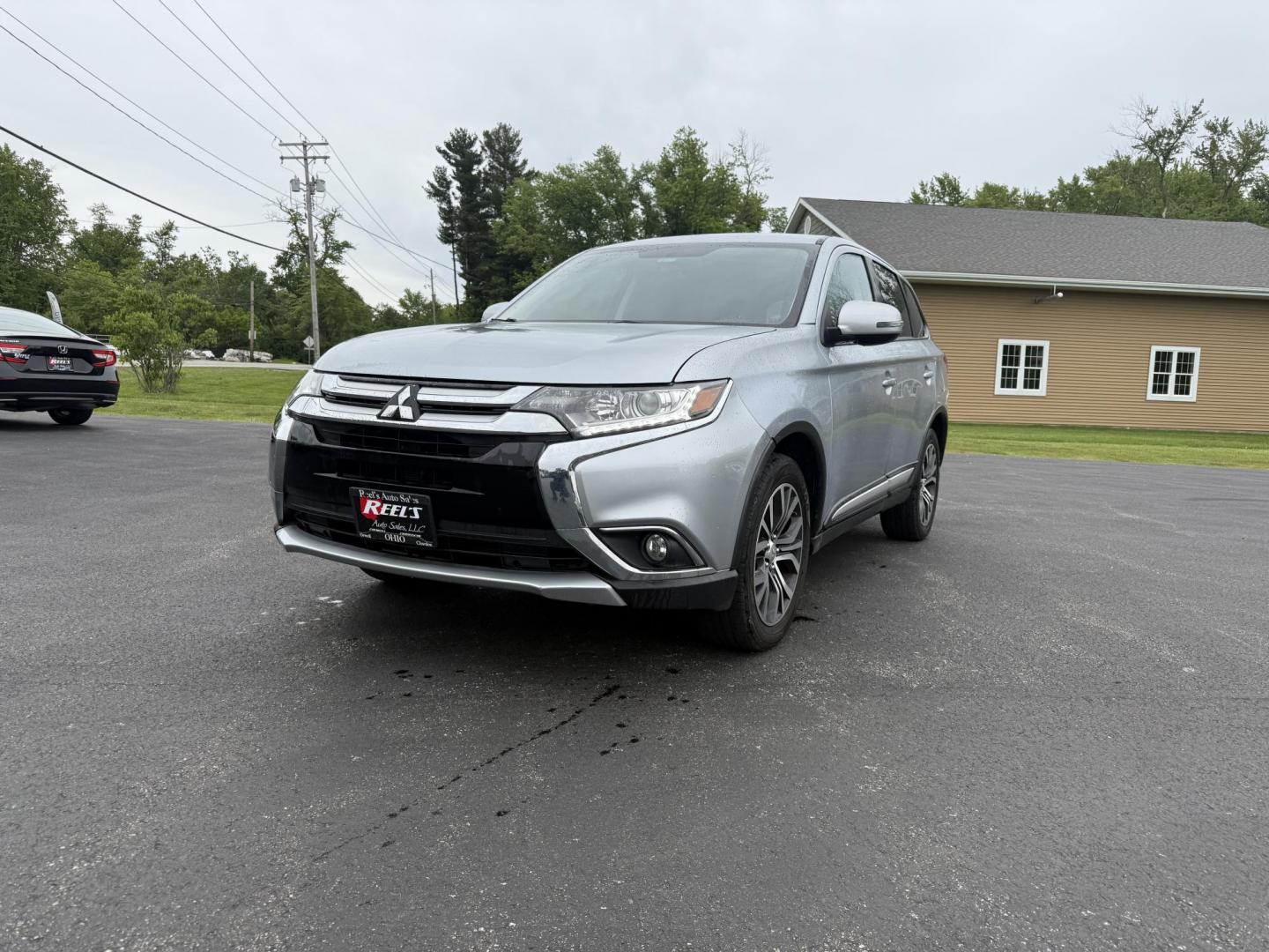 2017 Silver /Black Mitsubishi Outlander SE AWD (JA4AZ3A38HZ) with an 2.4L I4 DOHC 16V engine, Automatic transmission, located at 11115 Chardon Rd. , Chardon, OH, 44024, (440) 214-9705, 41.580246, -81.241943 - This 2017 Mitsubishi Outlander SE S-AWC is a fuel efficient all wheel drive SUV with a 3rd row. Powered by a 2.4 I4 Engine it is capable of achieving an impressive 29 MPG Highway. On the inside you get a 7.0" touch screen with Apple Carplay, Android Auto and, a backup camera. Other features include - Photo#0