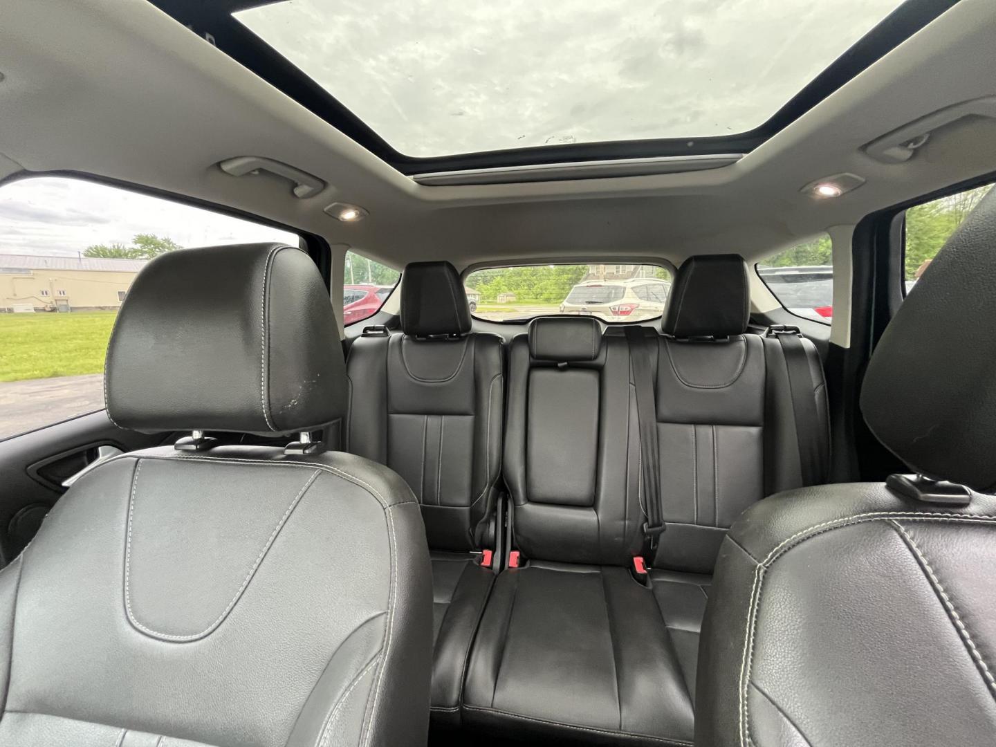 2013 Blue /Black Ford Escape Titanium 4WD (1FMCU9J99DU) with an 2.0L I4 DOHC 16V Turbo engine, 6-Speed Automatic transmission, located at 547 E. Main St., Orwell, OH, 44076, (440) 437-5893, 41.535435, -80.847855 - This 2013 Ford Escape is as loaded as an Escape can be. Powered by a 2.0 I4 Turbocharged EcoBoost engine and a 6 speed automatic transmission this Escape is quick yet fuel efficient. On the Inside you get a leather interior, power drivers seat W/ drivers memory functions, heated front seats and, a d - Photo#28