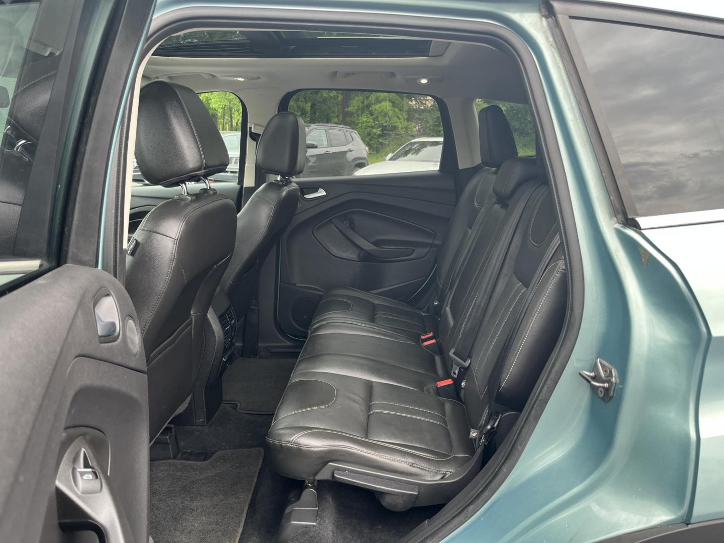 2013 Blue /Black Ford Escape Titanium 4WD (1FMCU9J99DU) with an 2.0L I4 DOHC 16V Turbo engine, 6-Speed Automatic transmission, located at 547 E. Main St., Orwell, OH, 44076, (440) 437-5893, 41.535435, -80.847855 - This 2013 Ford Escape is as loaded as an Escape can be. Powered by a 2.0 I4 Turbocharged EcoBoost engine and a 6 speed automatic transmission this Escape is quick yet fuel efficient. On the Inside you get a leather interior, power drivers seat W/ drivers memory functions, heated front seats and, a d - Photo#30