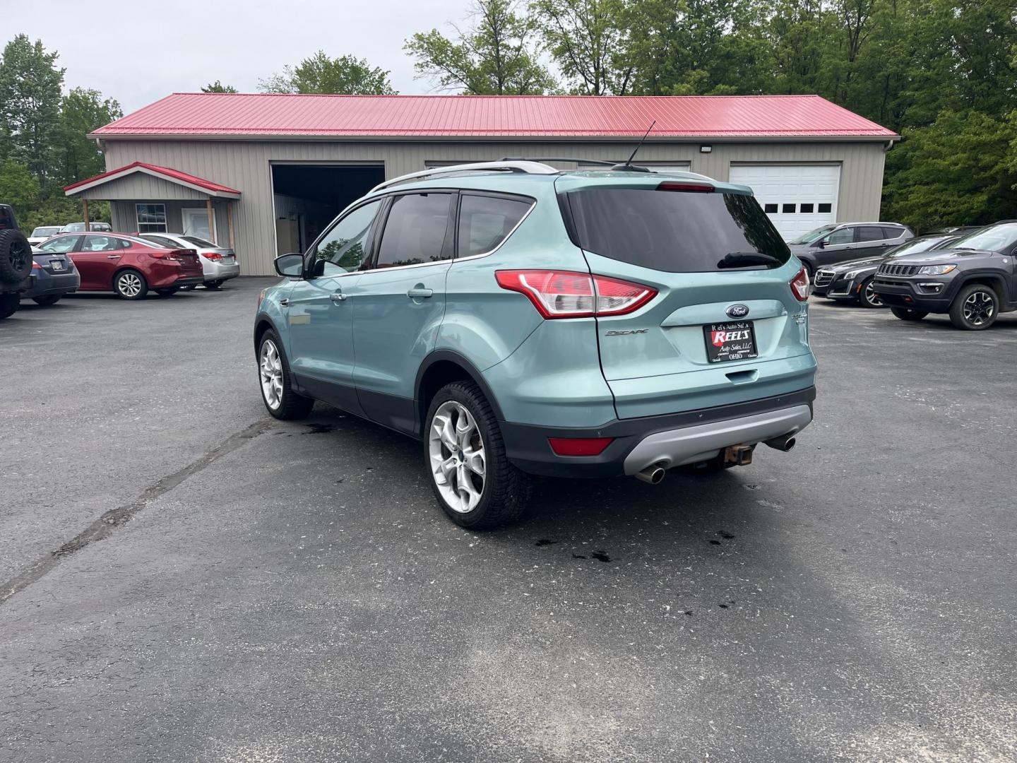 2013 Blue /Black Ford Escape Titanium 4WD (1FMCU9J99DU) with an 2.0L I4 DOHC 16V Turbo engine, 6-Speed Automatic transmission, located at 547 E. Main St., Orwell, OH, 44076, (440) 437-5893, 41.535435, -80.847855 - This 2013 Ford Escape is as loaded as an Escape can be. Powered by a 2.0 I4 Turbocharged EcoBoost engine and a 6 speed automatic transmission this Escape is quick yet fuel efficient. On the Inside you get a leather interior, power drivers seat W/ drivers memory functions, heated front seats and, a d - Photo#7