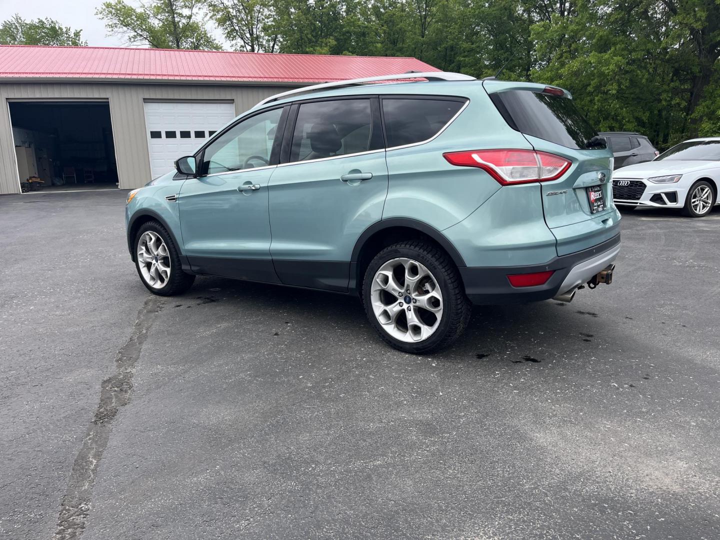 2013 Blue /Black Ford Escape Titanium 4WD (1FMCU9J99DU) with an 2.0L I4 DOHC 16V Turbo engine, 6-Speed Automatic transmission, located at 547 E. Main St., Orwell, OH, 44076, (440) 437-5893, 41.535435, -80.847855 - This 2013 Ford Escape is as loaded as an Escape can be. Powered by a 2.0 I4 Turbocharged EcoBoost engine and a 6 speed automatic transmission this Escape is quick yet fuel efficient. On the Inside you get a leather interior, power drivers seat W/ drivers memory functions, heated front seats and, a d - Photo#8