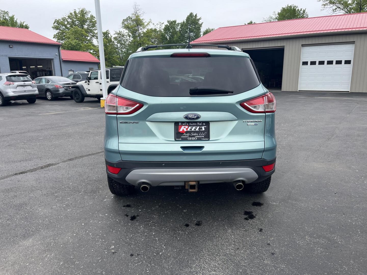 2013 Blue /Black Ford Escape Titanium 4WD (1FMCU9J99DU) with an 2.0L I4 DOHC 16V Turbo engine, 6-Speed Automatic transmission, located at 547 E. Main St., Orwell, OH, 44076, (440) 437-5893, 41.535435, -80.847855 - This 2013 Ford Escape is as loaded as an Escape can be. Powered by a 2.0 I4 Turbocharged EcoBoost engine and a 6 speed automatic transmission this Escape is quick yet fuel efficient. On the Inside you get a leather interior, power drivers seat W/ drivers memory functions, heated front seats and, a d - Photo#6