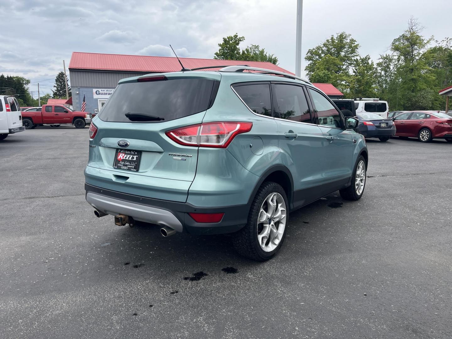 2013 Blue /Black Ford Escape Titanium 4WD (1FMCU9J99DU) with an 2.0L I4 DOHC 16V Turbo engine, 6-Speed Automatic transmission, located at 547 E. Main St., Orwell, OH, 44076, (440) 437-5893, 41.535435, -80.847855 - This 2013 Ford Escape is as loaded as an Escape can be. Powered by a 2.0 I4 Turbocharged EcoBoost engine and a 6 speed automatic transmission this Escape is quick yet fuel efficient. On the Inside you get a leather interior, power drivers seat W/ drivers memory functions, heated front seats and, a d - Photo#5