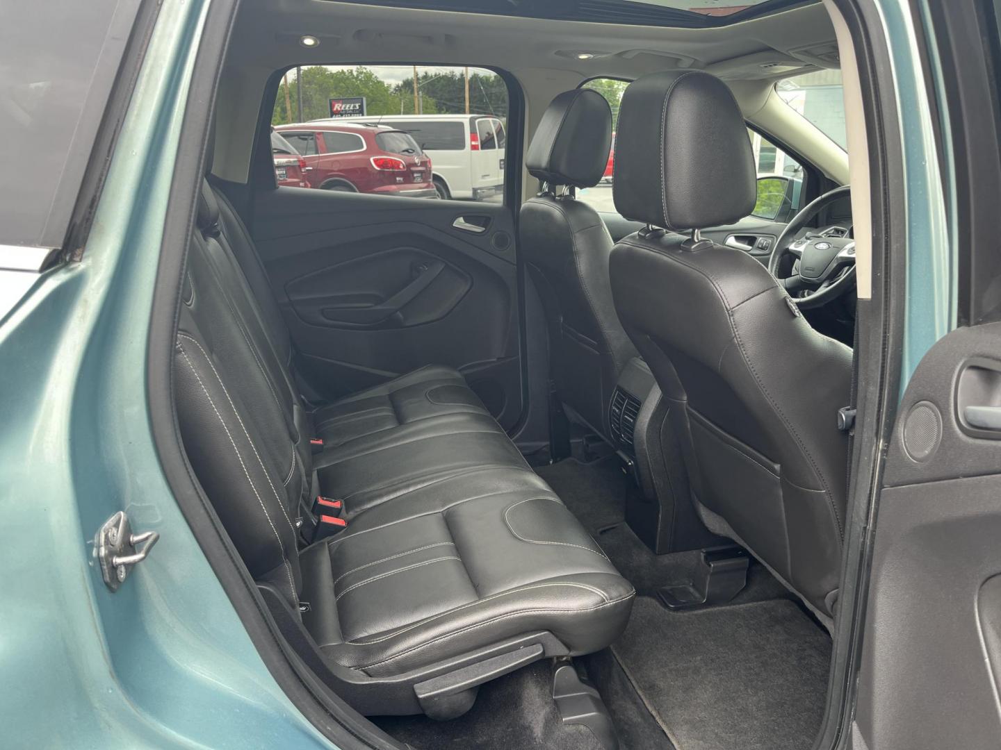 2013 Blue /Black Ford Escape Titanium 4WD (1FMCU9J99DU) with an 2.0L I4 DOHC 16V Turbo engine, 6-Speed Automatic transmission, located at 547 E. Main St., Orwell, OH, 44076, (440) 437-5893, 41.535435, -80.847855 - This 2013 Ford Escape is as loaded as an Escape can be. Powered by a 2.0 I4 Turbocharged EcoBoost engine and a 6 speed automatic transmission this Escape is quick yet fuel efficient. On the Inside you get a leather interior, power drivers seat W/ drivers memory functions, heated front seats and, a d - Photo#32
