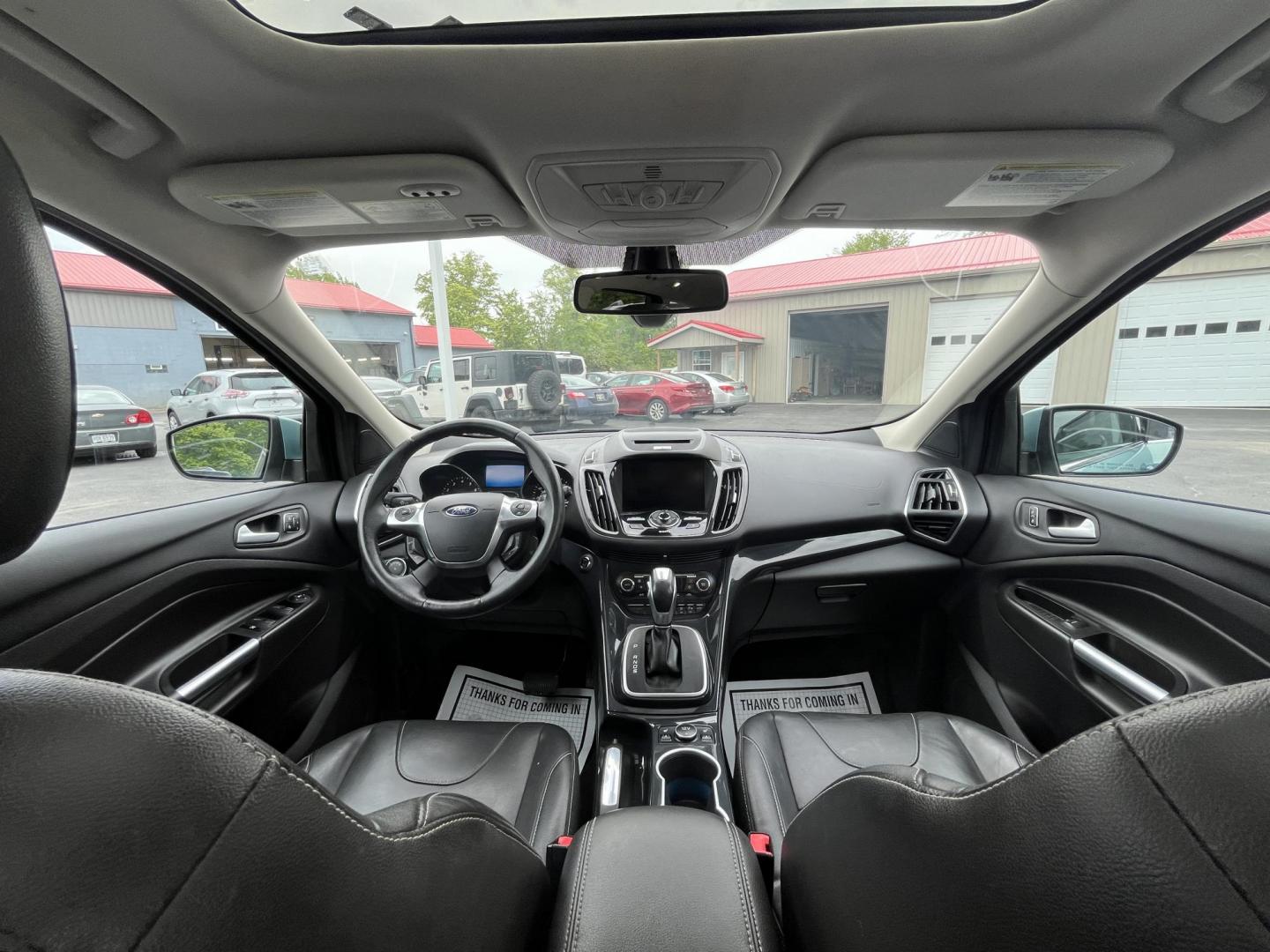 2013 Blue /Black Ford Escape Titanium 4WD (1FMCU9J99DU) with an 2.0L I4 DOHC 16V Turbo engine, 6-Speed Automatic transmission, located at 547 E. Main St., Orwell, OH, 44076, (440) 437-5893, 41.535435, -80.847855 - This 2013 Ford Escape is as loaded as an Escape can be. Powered by a 2.0 I4 Turbocharged EcoBoost engine and a 6 speed automatic transmission this Escape is quick yet fuel efficient. On the Inside you get a leather interior, power drivers seat W/ drivers memory functions, heated front seats and, a d - Photo#33