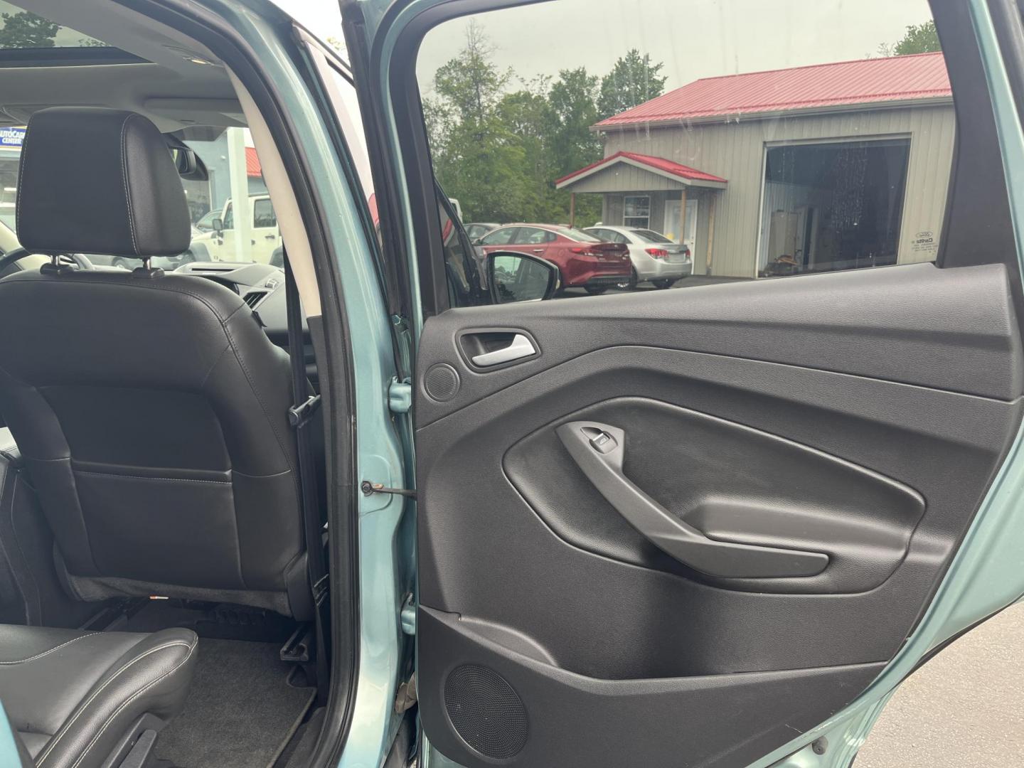 2013 Blue /Black Ford Escape Titanium 4WD (1FMCU9J99DU) with an 2.0L I4 DOHC 16V Turbo engine, 6-Speed Automatic transmission, located at 547 E. Main St., Orwell, OH, 44076, (440) 437-5893, 41.535435, -80.847855 - This 2013 Ford Escape is as loaded as an Escape can be. Powered by a 2.0 I4 Turbocharged EcoBoost engine and a 6 speed automatic transmission this Escape is quick yet fuel efficient. On the Inside you get a leather interior, power drivers seat W/ drivers memory functions, heated front seats and, a d - Photo#34