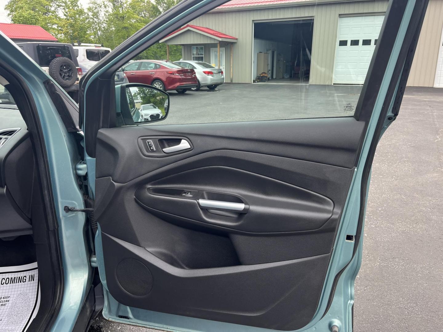 2013 Blue /Black Ford Escape Titanium 4WD (1FMCU9J99DU) with an 2.0L I4 DOHC 16V Turbo engine, 6-Speed Automatic transmission, located at 547 E. Main St., Orwell, OH, 44076, (440) 437-5893, 41.535435, -80.847855 - This 2013 Ford Escape is as loaded as an Escape can be. Powered by a 2.0 I4 Turbocharged EcoBoost engine and a 6 speed automatic transmission this Escape is quick yet fuel efficient. On the Inside you get a leather interior, power drivers seat W/ drivers memory functions, heated front seats and, a d - Photo#37