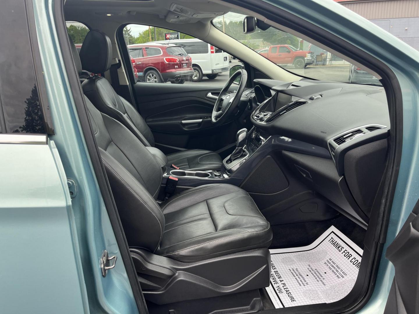 2013 Blue /Black Ford Escape Titanium 4WD (1FMCU9J99DU) with an 2.0L I4 DOHC 16V Turbo engine, 6-Speed Automatic transmission, located at 547 E. Main St., Orwell, OH, 44076, (440) 437-5893, 41.535435, -80.847855 - This 2013 Ford Escape is as loaded as an Escape can be. Powered by a 2.0 I4 Turbocharged EcoBoost engine and a 6 speed automatic transmission this Escape is quick yet fuel efficient. On the Inside you get a leather interior, power drivers seat W/ drivers memory functions, heated front seats and, a d - Photo#35