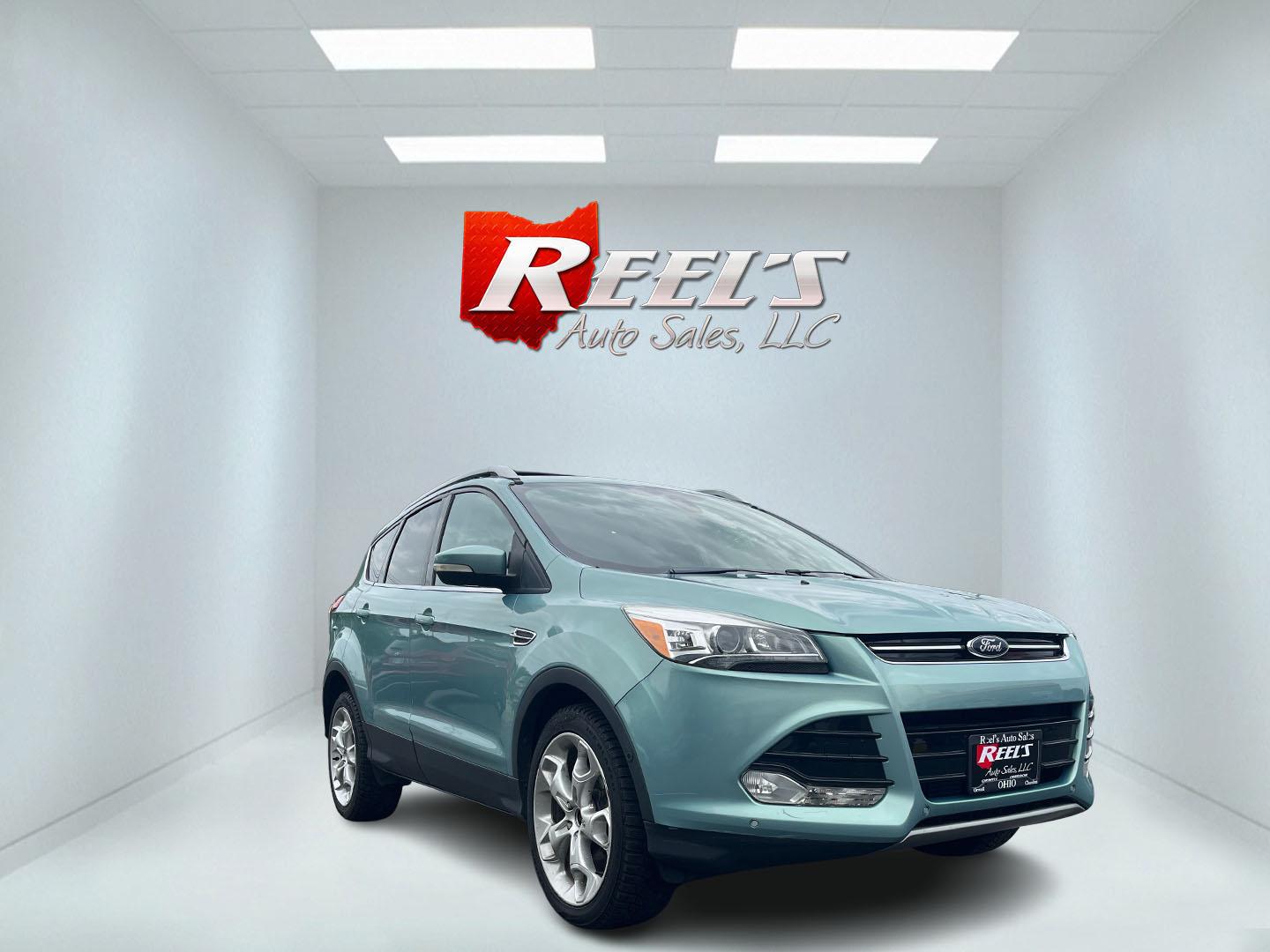 2013 Blue /Black Ford Escape Titanium 4WD (1FMCU9J99DU) with an 2.0L I4 DOHC 16V Turbo engine, 6-Speed Automatic transmission, located at 547 E. Main St., Orwell, OH, 44076, (440) 437-5893, 41.535435, -80.847855 - This 2013 Ford Escape is as loaded as an Escape can be. Powered by a 2.0 I4 Turbocharged EcoBoost engine and a 6 speed automatic transmission this Escape is quick yet fuel efficient. On the Inside you get a leather interior, power drivers seat W/ drivers memory functions, heated front seats and, a d - Photo#2