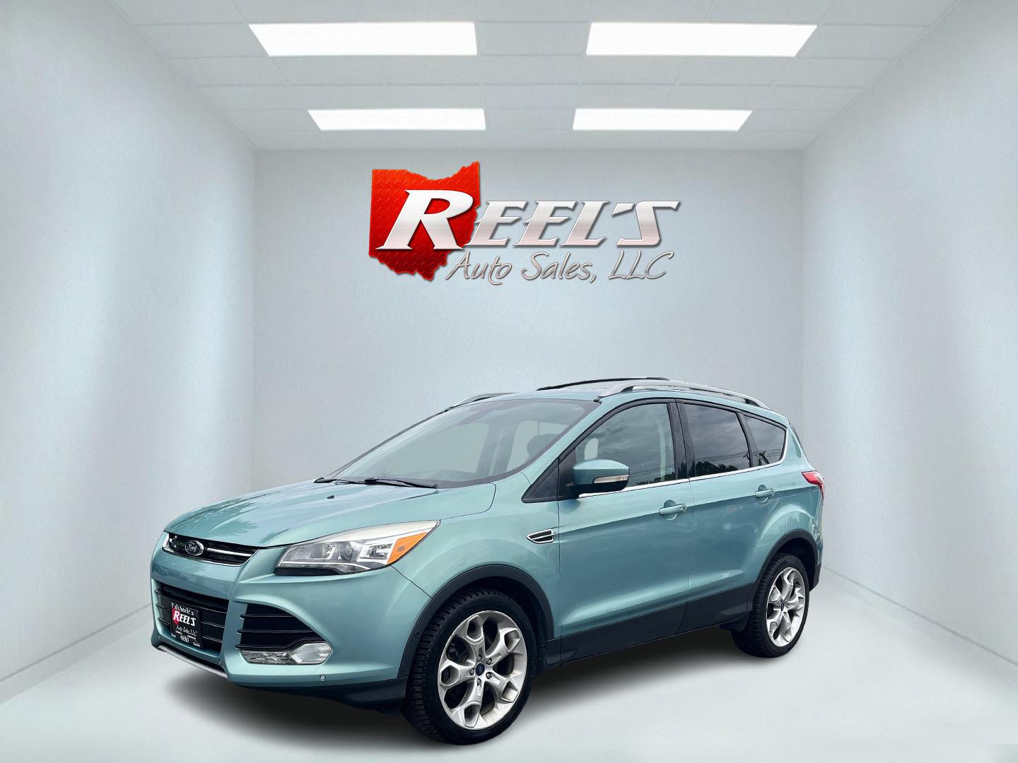2013 Blue /Black Ford Escape Titanium 4WD (1FMCU9J99DU) with an 2.0L I4 DOHC 16V Turbo engine, 6-Speed Automatic transmission, located at 547 E. Main St., Orwell, OH, 44076, (440) 437-5893, 41.535435, -80.847855 - This 2013 Ford Escape is as loaded as an Escape can be. Powered by a 2.0 I4 Turbocharged EcoBoost engine and a 6 speed automatic transmission this Escape is quick yet fuel efficient. On the Inside you get a leather interior, power drivers seat W/ drivers memory functions, heated front seats and, a d - Photo#33