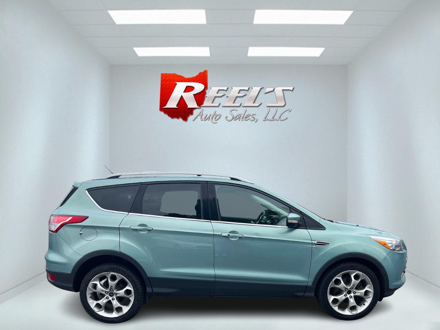 2013 Blue /Black Ford Escape Titanium 4WD (1FMCU9J99DU) with an 2.0L I4 DOHC 16V Turbo engine, 6-Speed Automatic transmission, located at 547 E. Main St., Orwell, OH, 44076, (440) 437-5893, 41.535435, -80.847855 - This 2013 Ford Escape is as loaded as an Escape can be. Powered by a 2.0 I4 Turbocharged EcoBoost engine and a 6 speed automatic transmission this Escape is quick yet fuel efficient. On the Inside you get a leather interior, power drivers seat W/ drivers memory functions, heated front seats and, a d - Photo#35