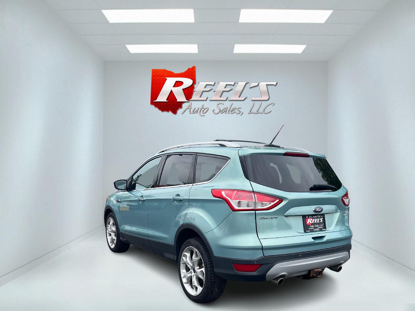 2013 Blue /Black Ford Escape Titanium 4WD (1FMCU9J99DU) with an 2.0L I4 DOHC 16V Turbo engine, 6-Speed Automatic transmission, located at 547 E. Main St., Orwell, OH, 44076, (440) 437-5893, 41.535435, -80.847855 - This 2013 Ford Escape is as loaded as an Escape can be. Powered by a 2.0 I4 Turbocharged EcoBoost engine and a 6 speed automatic transmission this Escape is quick yet fuel efficient. On the Inside you get a leather interior, power drivers seat W/ drivers memory functions, heated front seats and, a d - Photo#21
