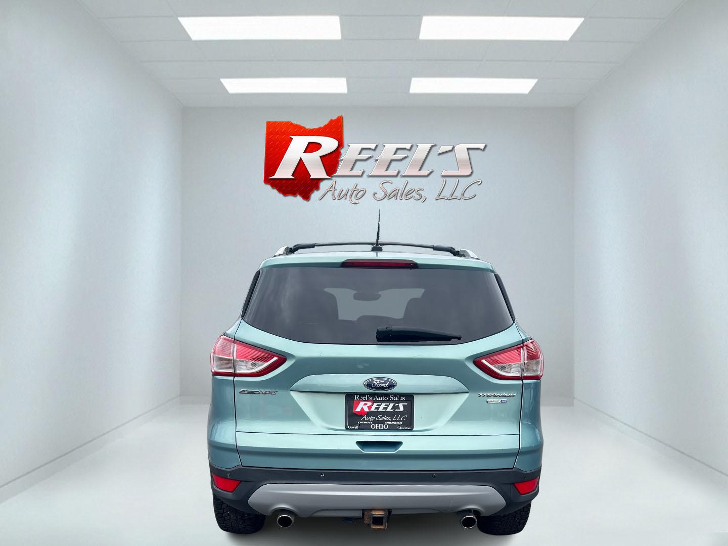 2013 Blue /Black Ford Escape Titanium 4WD (1FMCU9J99DU) with an 2.0L I4 DOHC 16V Turbo engine, 6-Speed Automatic transmission, located at 547 E. Main St., Orwell, OH, 44076, (440) 437-5893, 41.535435, -80.847855 - This 2013 Ford Escape is as loaded as an Escape can be. Powered by a 2.0 I4 Turbocharged EcoBoost engine and a 6 speed automatic transmission this Escape is quick yet fuel efficient. On the Inside you get a leather interior, power drivers seat W/ drivers memory functions, heated front seats and, a d - Photo#20