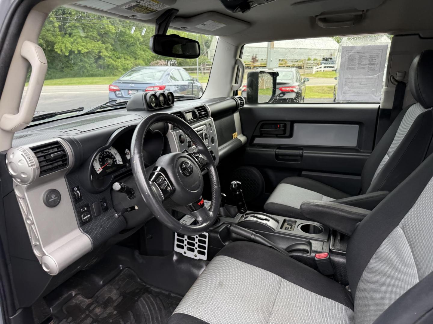 2013 Silver /Black Toyota FJ Cruiser 4WD AT (JTEBU4BF2DK) with an 4.0L V6 DOHC 24V engine, 5-Speed Automatic transmission, located at 11115 Chardon Rd. , Chardon, OH, 44024, (440) 214-9705, 41.580246, -81.241943 - This 2013 Toyota FJ Cruiser has Jeep off-road cred with Toyota's incredible reputation for reliability. Powered by the incredible 4.0 V6 and a 5 speed automatic transmission this thing has the grunt to go over any off-road obstacle or, tow 5,000 pounds. This FJ Cruiser has the off-road package, TRD - Photo#9