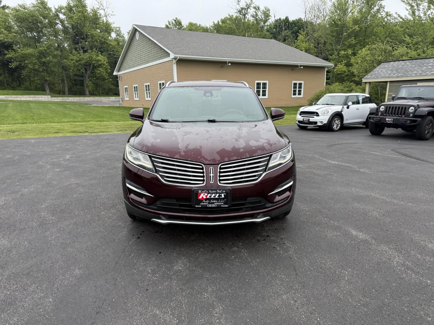 2016 Red /Black Lincoln MKC Reserve AWD (5LMCJ3D98GU) with an 2.0L I4 DOHC 16V Turbo engine, 6-Speed Automatic transmission, located at 11115 Chardon Rd. , Chardon, OH, 44024, (440) 214-9705, 41.580246, -81.241943 - Photo#1