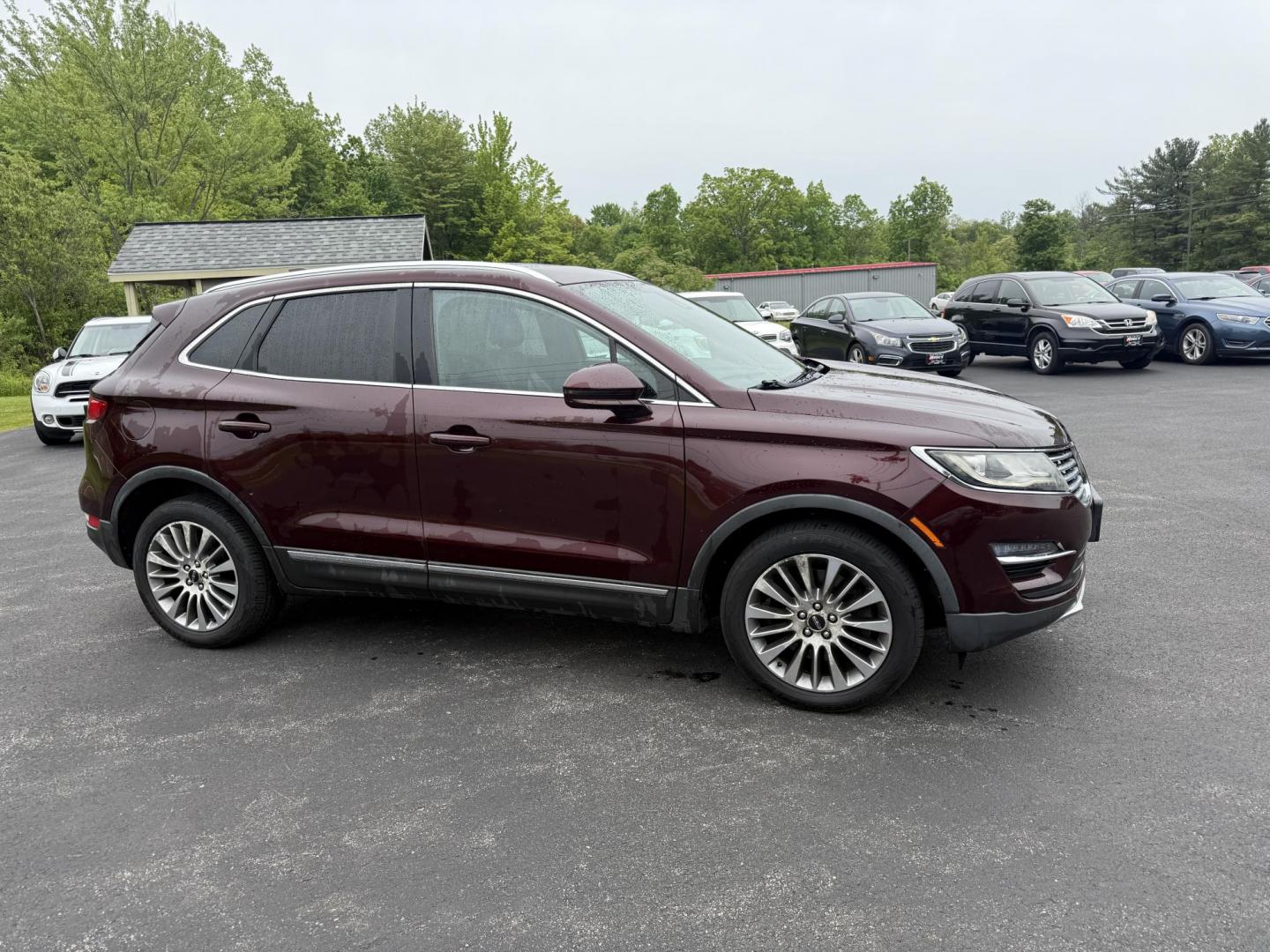 2016 Red /Black Lincoln MKC Reserve AWD (5LMCJ3D98GU) with an 2.0L I4 DOHC 16V Turbo engine, 6-Speed Automatic transmission, located at 11115 Chardon Rd. , Chardon, OH, 44024, (440) 214-9705, 41.580246, -81.241943 - Photo#3