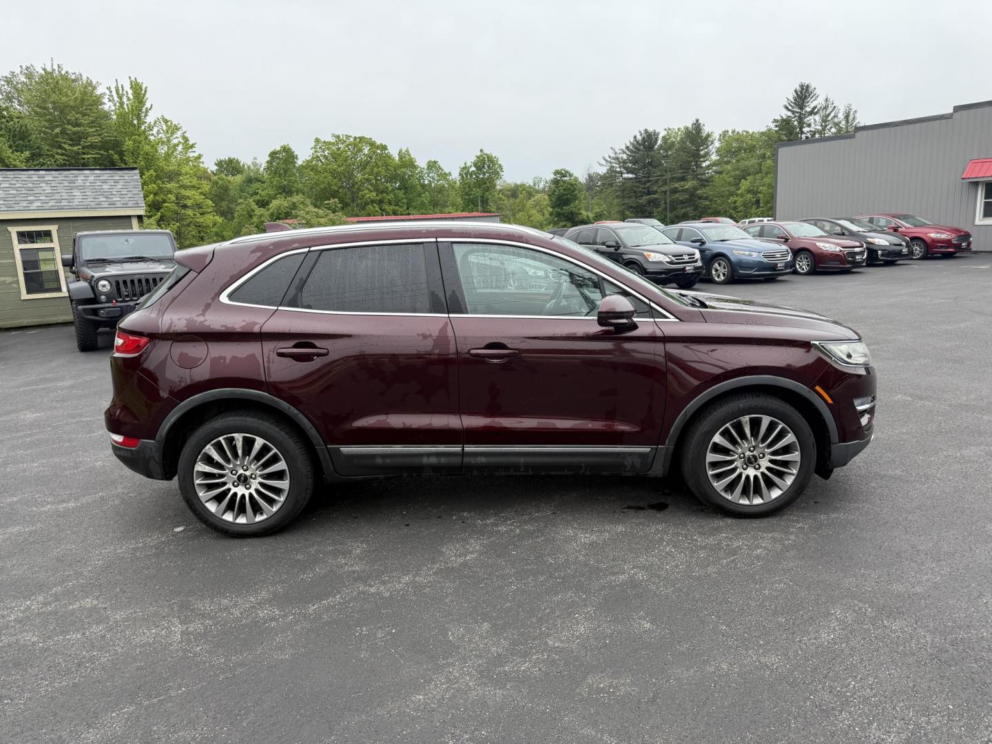 2016 Red /Black Lincoln MKC Reserve AWD (5LMCJ3D98GU) with an 2.0L I4 DOHC 16V Turbo engine, 6-Speed Automatic transmission, located at 11115 Chardon Rd. , Chardon, OH, 44024, (440) 214-9705, 41.580246, -81.241943 - Photo#5