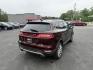 2016 Red /Black Lincoln MKC Reserve AWD (5LMCJ3D98GU) with an 2.0L I4 DOHC 16V Turbo engine, 6-Speed Automatic transmission, located at 11115 Chardon Rd. , Chardon, OH, 44024, (440) 214-9705, 41.580246, -81.241943 - Photo#7