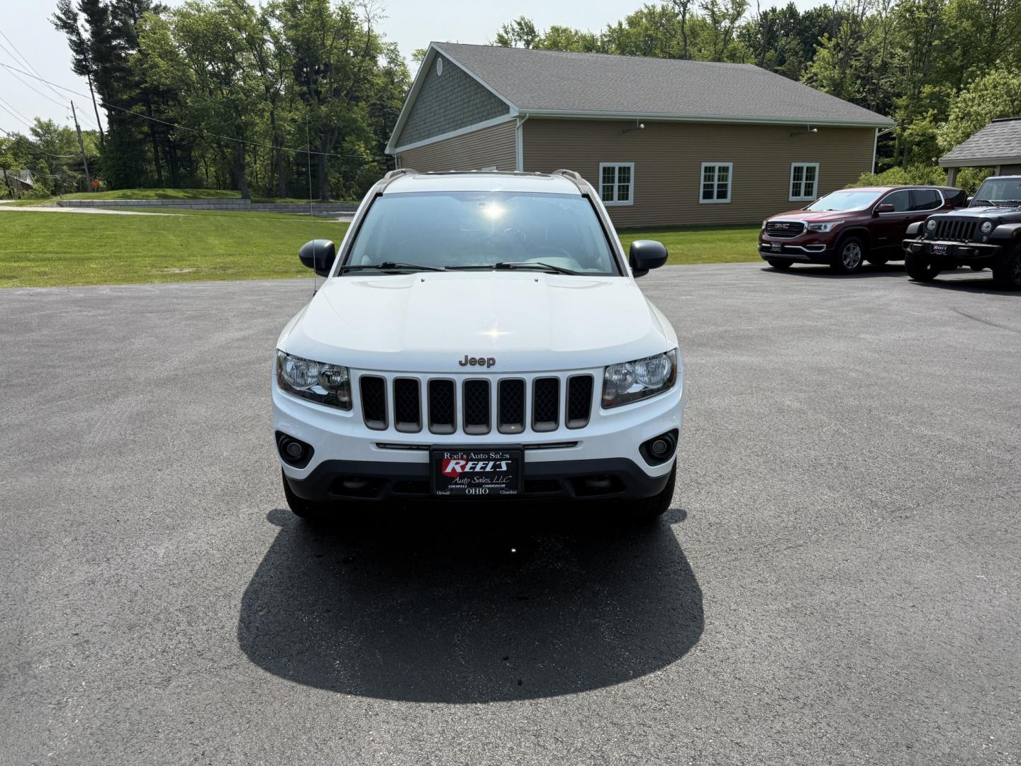 2016 White /Gray Jeep Compass Sport 75th Anniversary 4WD (1C4NJDBB9GD) with an 2.4L I4 DOHC 16V engine, 6-Speed Automatic transmission, located at 11115 Chardon Rd. , Chardon, OH, 44024, (440) 214-9705, 41.580246, -81.241943 - This 2016 Jeep Compass Sport 4WD 75th Edition is a compact go anywhere SUV. Powered by a 2.4 I4 engine and a 6 speed automatic transmission this little Jeep is respectable on gas while still being able to tackle any weather condition that is thrown it's way. This Jeep gives you added peace of mind w - Photo#1