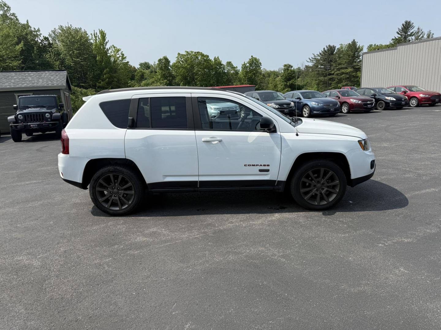 2016 White /Gray Jeep Compass Sport 75th Anniversary 4WD (1C4NJDBB9GD) with an 2.4L I4 DOHC 16V engine, 6-Speed Automatic transmission, located at 11115 Chardon Rd. , Chardon, OH, 44024, (440) 214-9705, 41.580246, -81.241943 - This 2016 Jeep Compass Sport 4WD 75th Edition is a compact go anywhere SUV. Powered by a 2.4 I4 engine and a 6 speed automatic transmission this little Jeep is respectable on gas while still being able to tackle any weather condition that is thrown it's way. This Jeep gives you added peace of mind w - Photo#6
