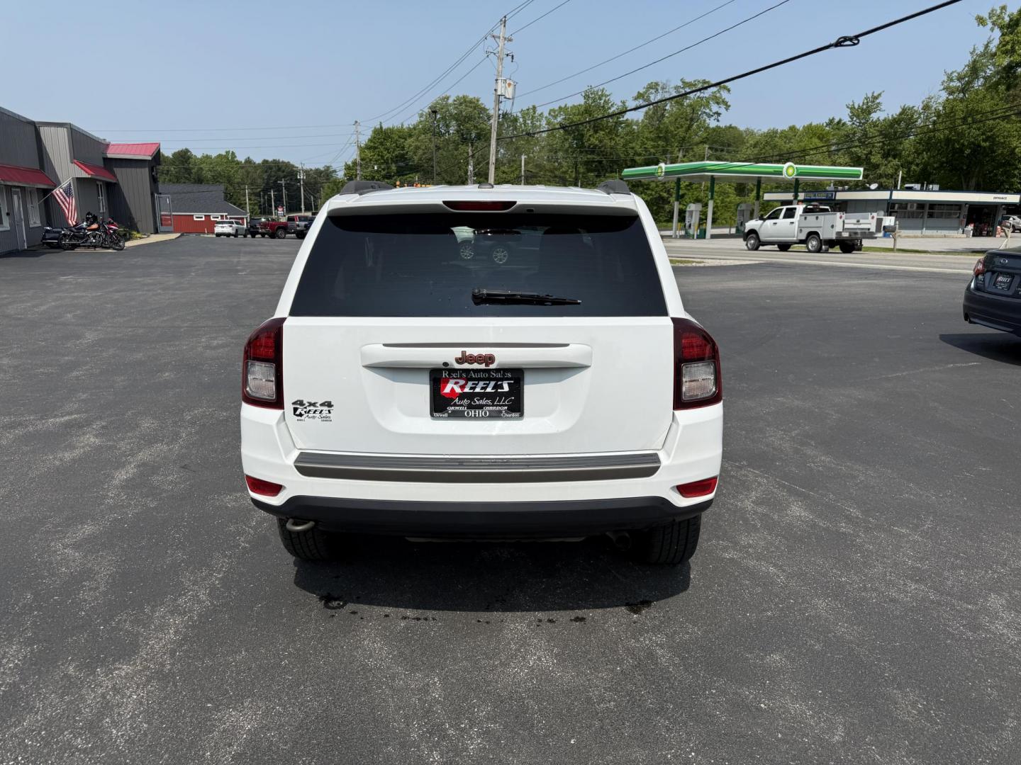 2016 White /Gray Jeep Compass Sport 75th Anniversary 4WD (1C4NJDBB9GD) with an 2.4L I4 DOHC 16V engine, 6-Speed Automatic transmission, located at 11115 Chardon Rd. , Chardon, OH, 44024, (440) 214-9705, 41.580246, -81.241943 - This 2016 Jeep Compass Sport 4WD 75th Edition is a compact go anywhere SUV. Powered by a 2.4 I4 engine and a 6 speed automatic transmission this little Jeep is respectable on gas while still being able to tackle any weather condition that is thrown it's way. This Jeep gives you added peace of mind w - Photo#9
