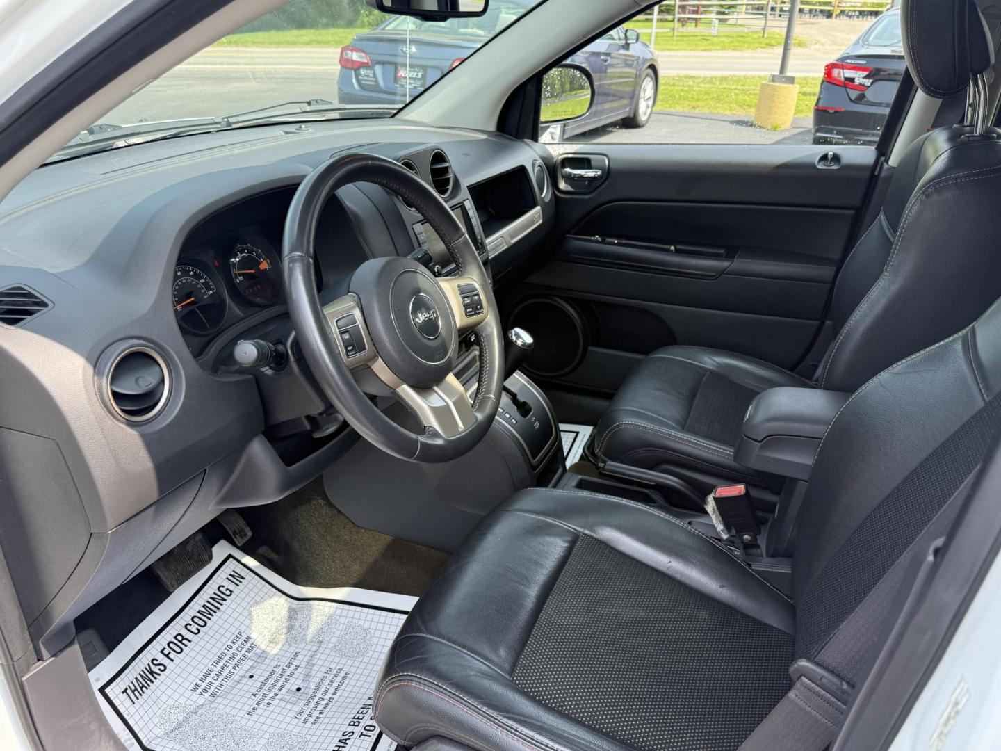 2016 White /Gray Jeep Compass Sport 75th Anniversary 4WD (1C4NJDBB9GD) with an 2.4L I4 DOHC 16V engine, 6-Speed Automatic transmission, located at 11115 Chardon Rd. , Chardon, OH, 44024, (440) 214-9705, 41.580246, -81.241943 - This 2016 Jeep Compass Sport 4WD 75th Edition is a compact go anywhere SUV. Powered by a 2.4 I4 engine and a 6 speed automatic transmission this little Jeep is respectable on gas while still being able to tackle any weather condition that is thrown it's way. This Jeep gives you added peace of mind w - Photo#16