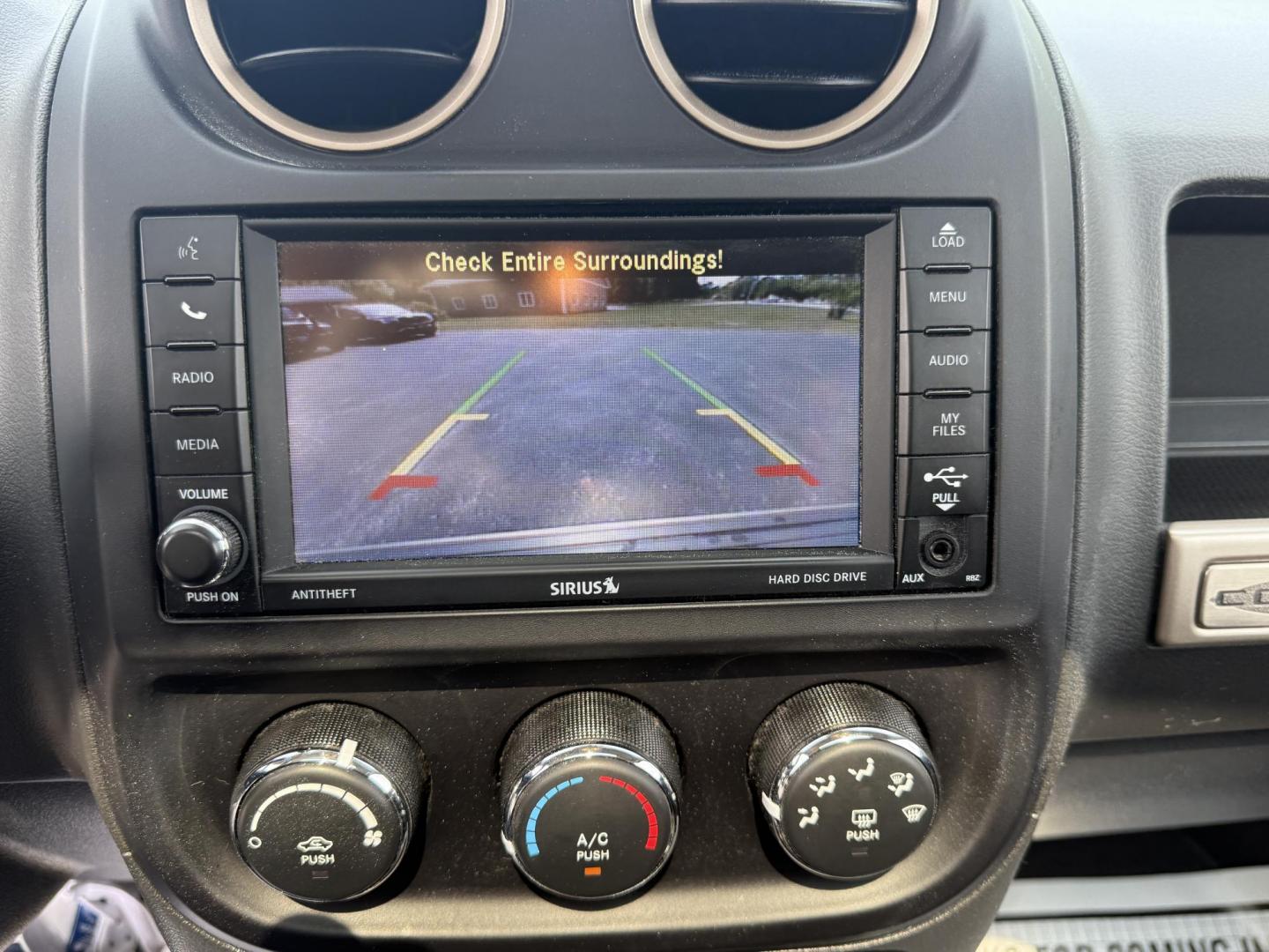 2016 White /Gray Jeep Compass Sport 75th Anniversary 4WD (1C4NJDBB9GD) with an 2.4L I4 DOHC 16V engine, 6-Speed Automatic transmission, located at 11115 Chardon Rd. , Chardon, OH, 44024, (440) 214-9705, 41.580246, -81.241943 - This 2016 Jeep Compass Sport 4WD 75th Edition is a compact go anywhere SUV. Powered by a 2.4 I4 engine and a 6 speed automatic transmission this little Jeep is respectable on gas while still being able to tackle any weather condition that is thrown it's way. This Jeep gives you added peace of mind w - Photo#22
