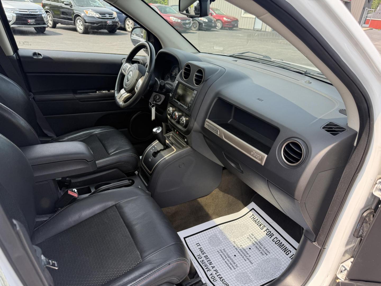 2016 White /Gray Jeep Compass Sport 75th Anniversary 4WD (1C4NJDBB9GD) with an 2.4L I4 DOHC 16V engine, 6-Speed Automatic transmission, located at 11115 Chardon Rd. , Chardon, OH, 44024, (440) 214-9705, 41.580246, -81.241943 - This 2016 Jeep Compass Sport 4WD 75th Edition is a compact go anywhere SUV. Powered by a 2.4 I4 engine and a 6 speed automatic transmission this little Jeep is respectable on gas while still being able to tackle any weather condition that is thrown it's way. This Jeep gives you added peace of mind w - Photo#37