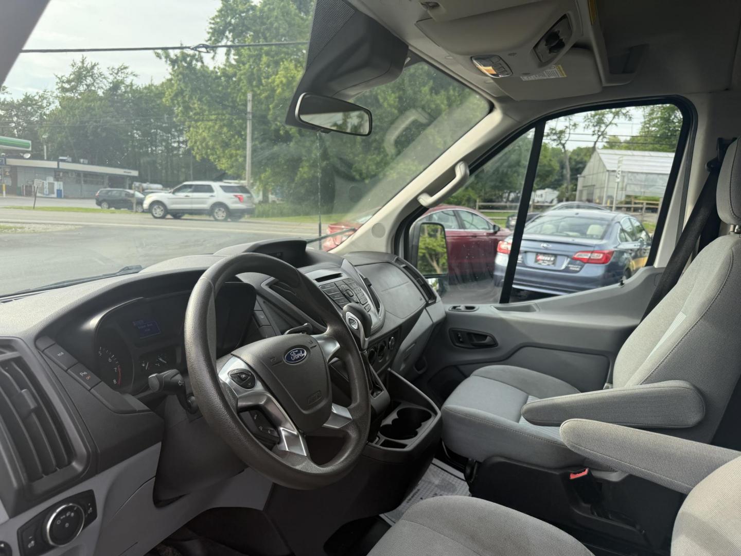 2016 White /Gray Ford Transit 350 Wagon Med. Roof XL w/Sliding Pass. 148-in. WB (1FBAX2CM5GK) with an 3.7L V6 DOHC 24V engine, 6A transmission, located at 11115 Chardon Rd. , Chardon, OH, 44024, (440) 214-9705, 41.580246, -81.241943 - This 2016 Ford Transit 350 XLT Medium Roof is a versatile full-size van powered by a 3.7L V6 engine with a 6-speed automatic transmission and flex fuel capability, featuring 3.73 rear gearing for added performance and a 5,000-pound towing capacity. It offers seating for up to 15 passengers, making i - Photo#8